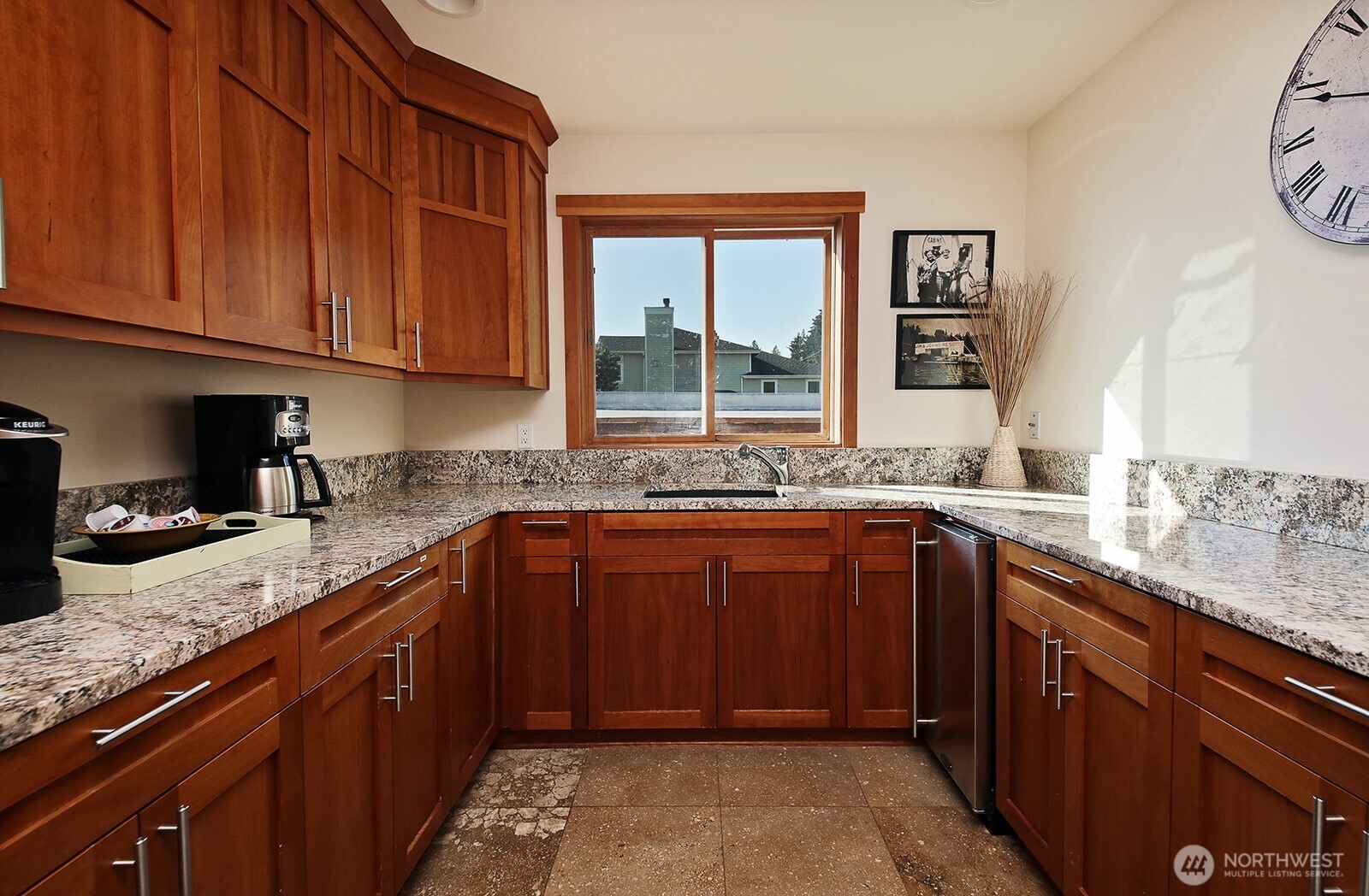 4913 Marshall Road Clinton, WA 98236 - Photo 21 of 40 a kitchen with stainless steel appliances granite countertop a sink stove and cabinets