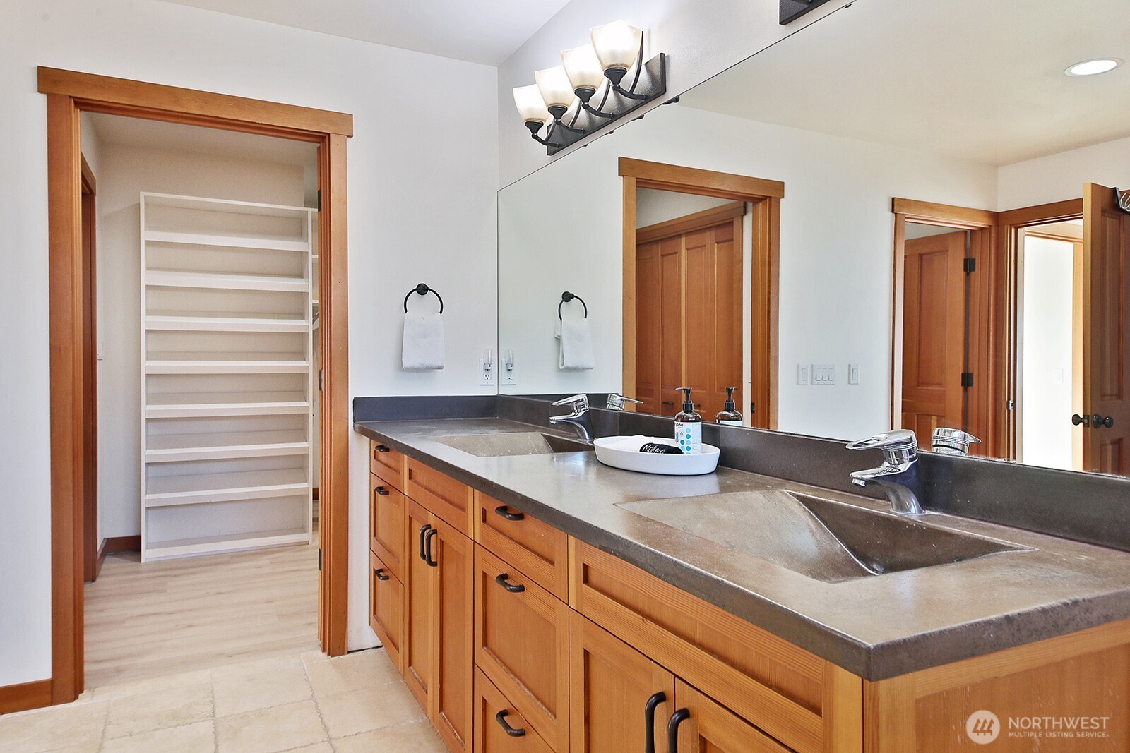 4913 Marshall Road Clinton, WA 98236 - Photo 24 of 40 a bathroom with double sink and a mirror