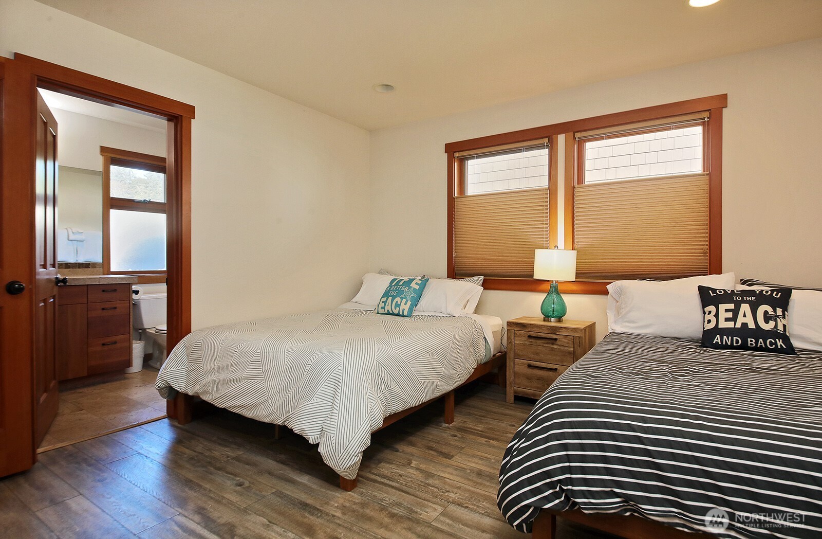 4913 Marshall Road Clinton, WA 98236 - Photo 28 of 40 a bedroom with two beds and a large window