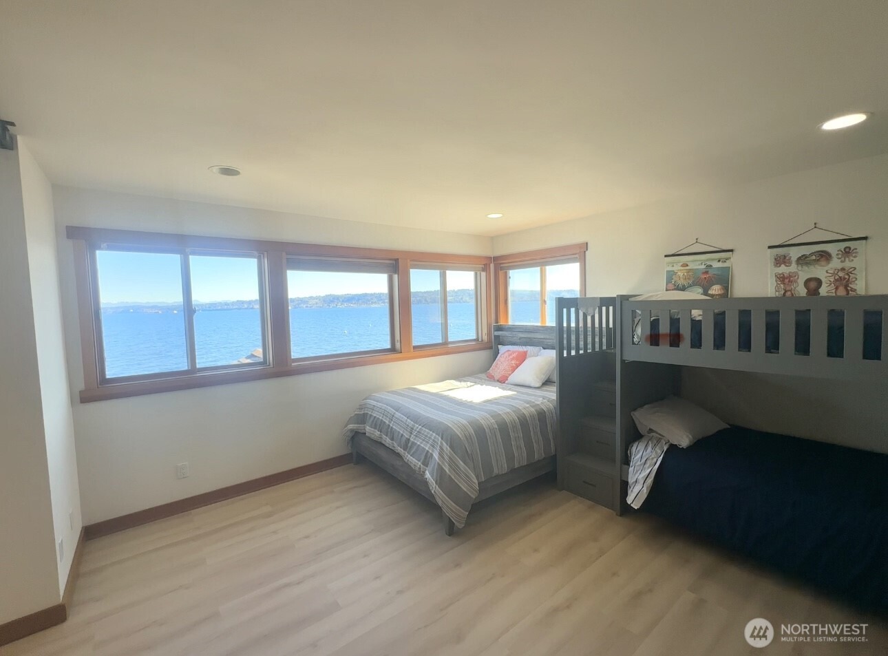 4913 Marshall Road Clinton, WA 98236 - Photo 30 of 40 a spacious bedroom with a bed and a window