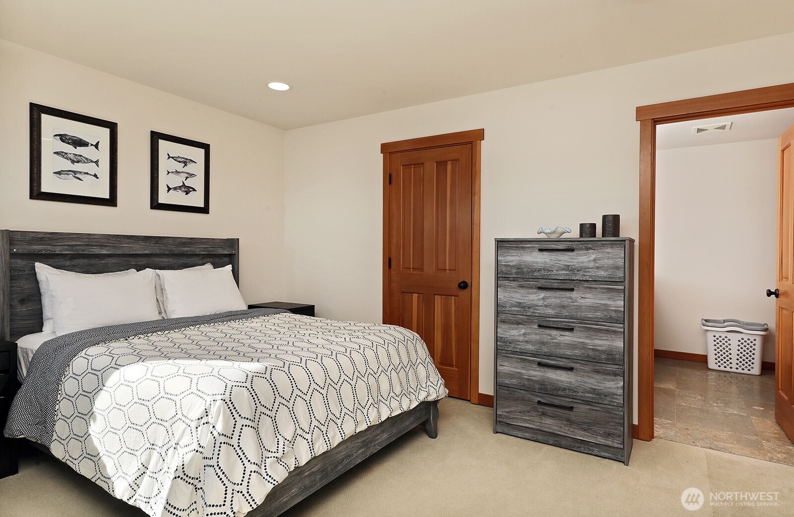 4913 Marshall Road Clinton, WA 98236 - Photo 31 of 40 a bedroom with a bed and a lamp