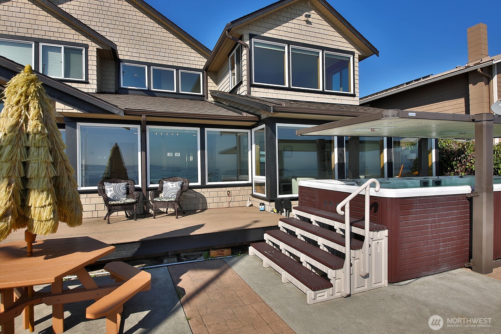 4913 Marshall Road Clinton, WA 98236 - Photo 33 of 40 a patio with a table and chairs