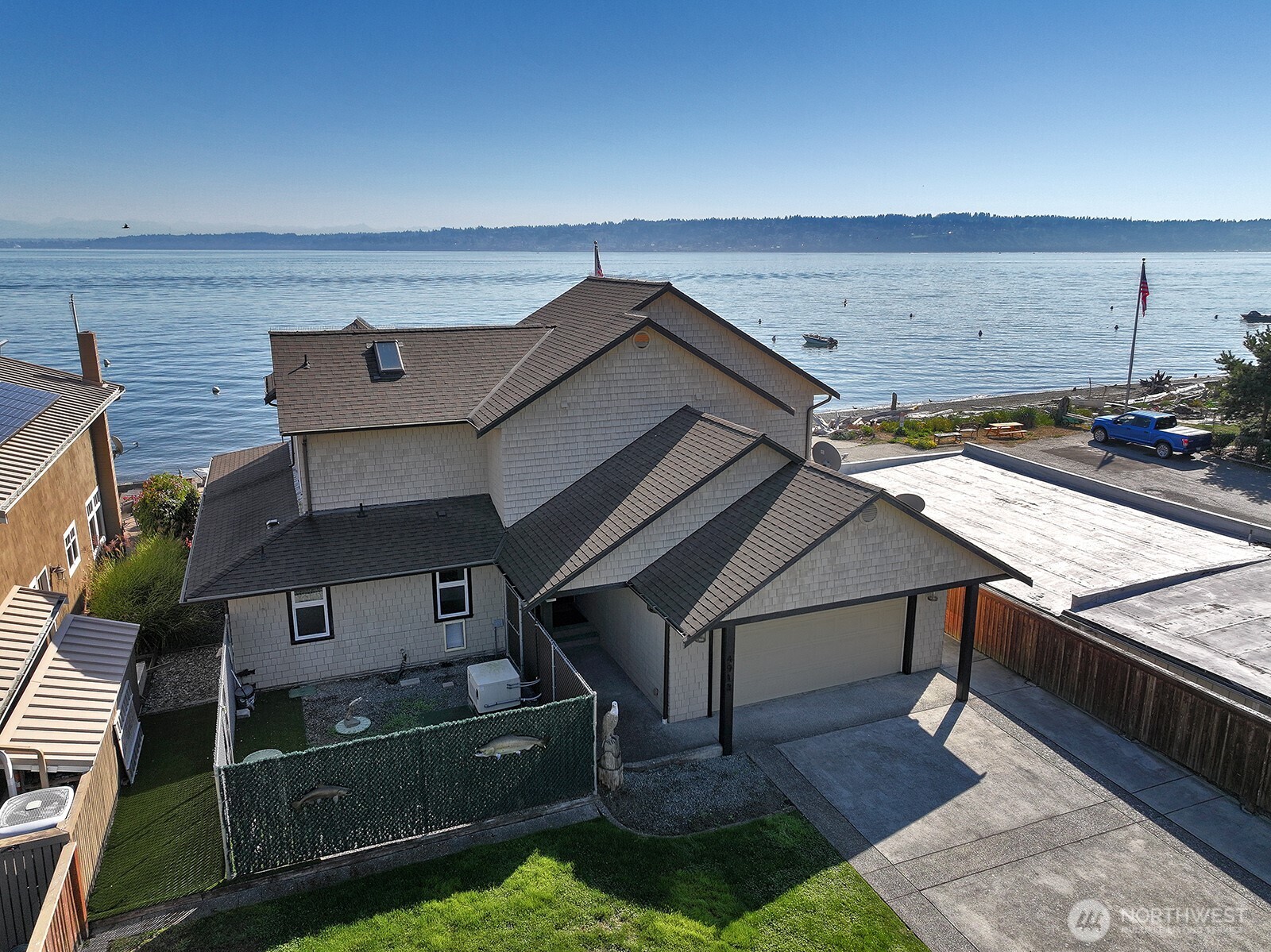 4913 Marshall Road Clinton, WA 98236 - Photo 9 of 40 an aerial view of a house with roof deck