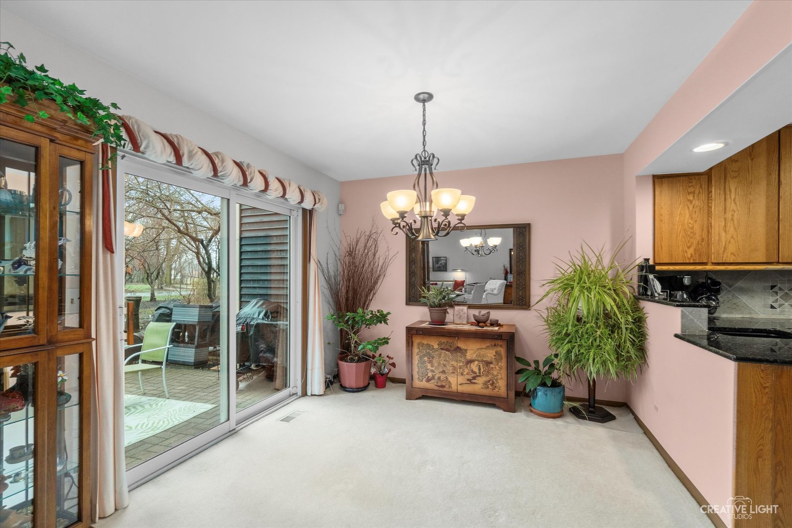 683 Bent Ridge Lane Elgin, IL 60120 - Photo 12 of 27 a view of a room with a chandelier and living room