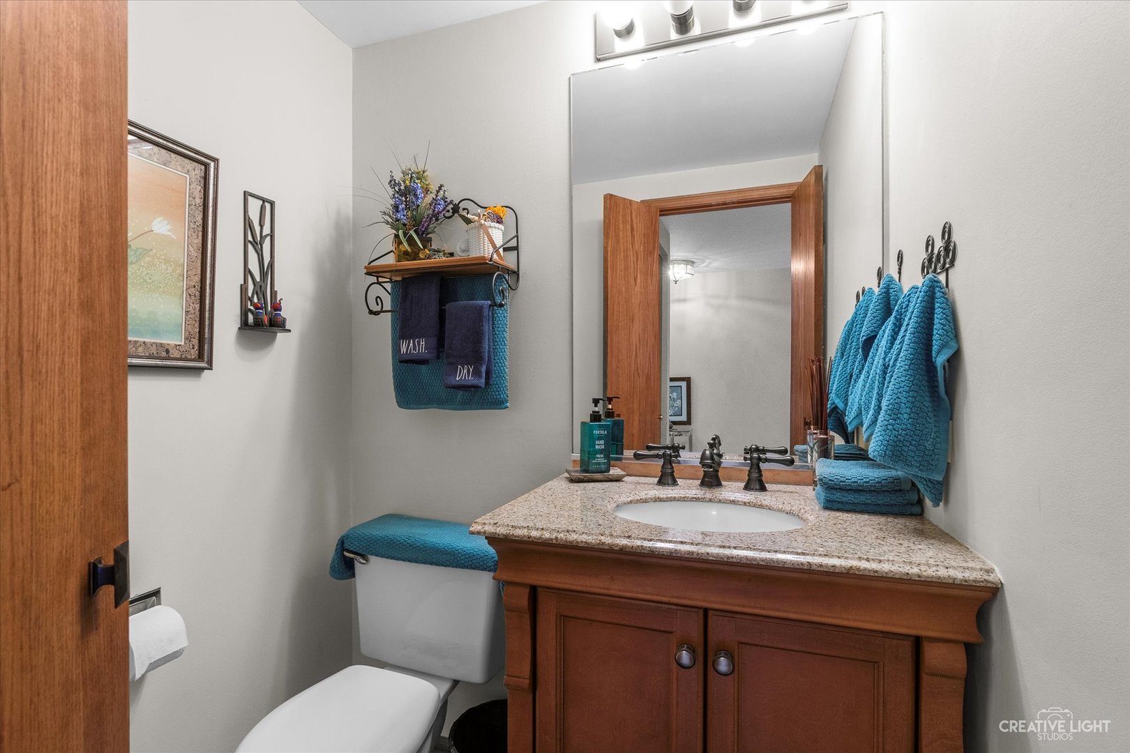683 Bent Ridge Lane Elgin, IL 60120 - Photo 15 of 27 a bathroom with a toilet sink and mirror