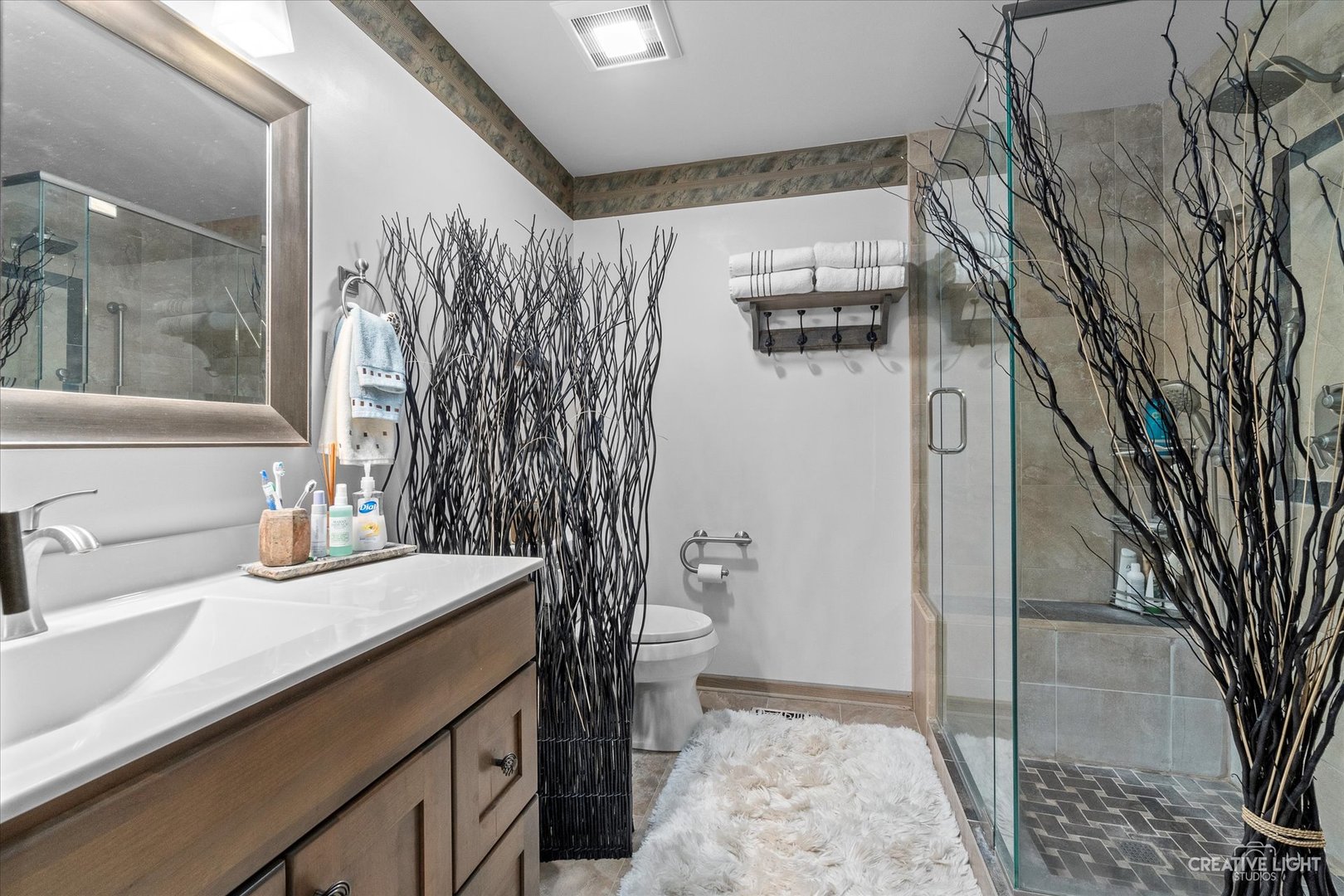 683 Bent Ridge Lane Elgin, IL 60120 - Photo 18 of 27 a bathroom with a sink a toilet and shower