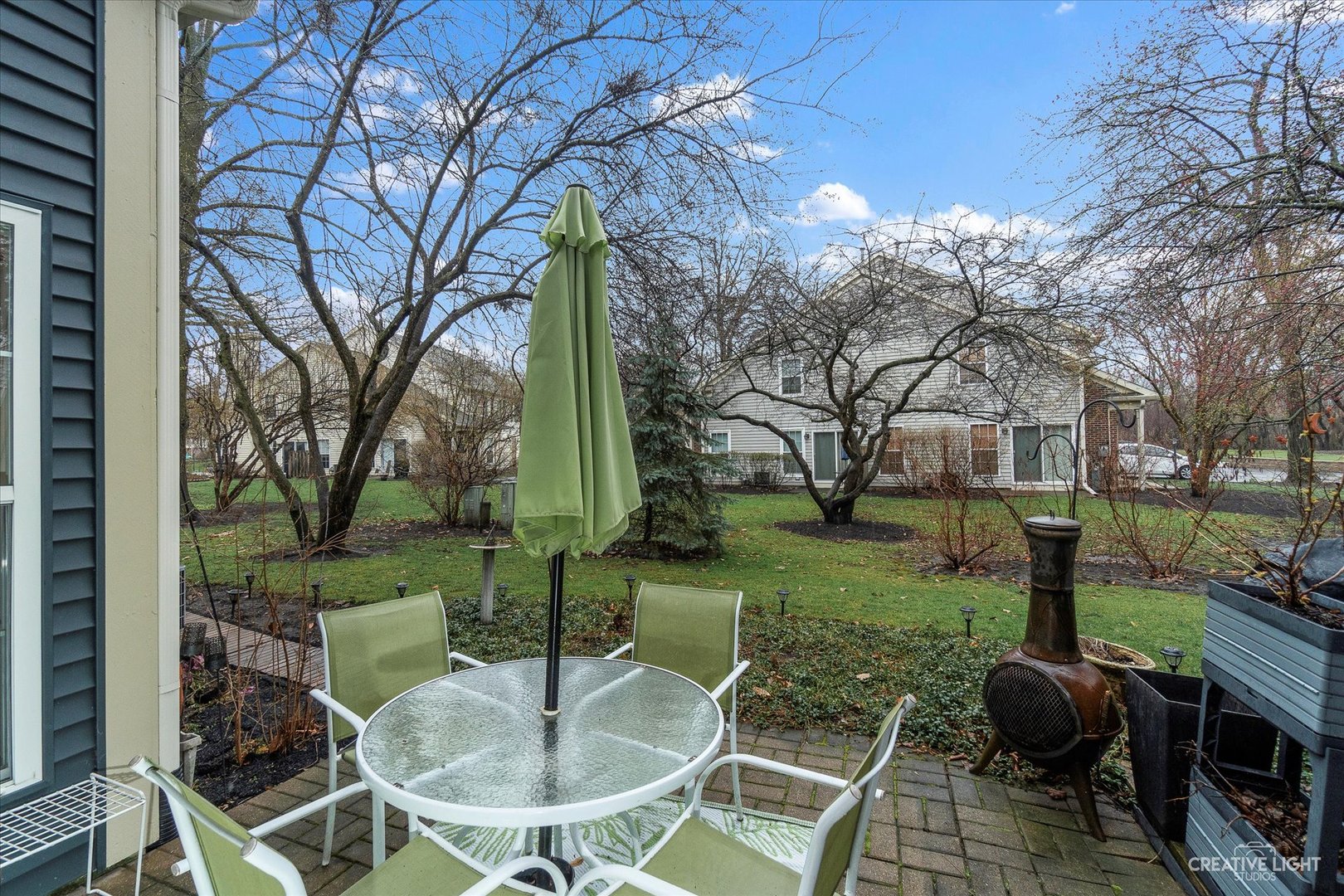 683 Bent Ridge Lane Elgin, IL 60120 - Photo 25 of 27 a backyard of a house with barbeque oven table and chairs