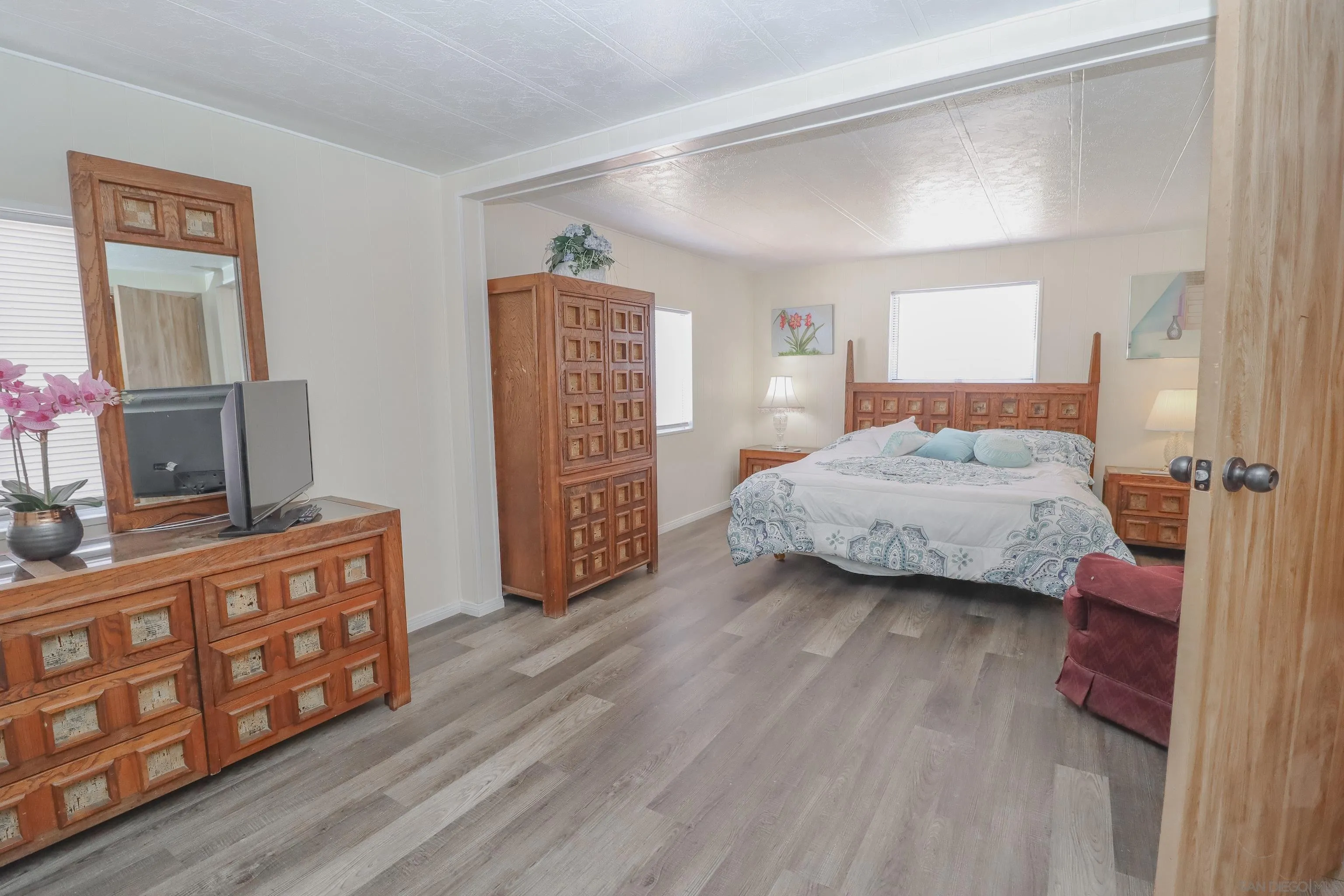21141 Sharp Road Perris, CA 92570 - Photo 14 of 43 a bedroom with a bed and a dresser in it