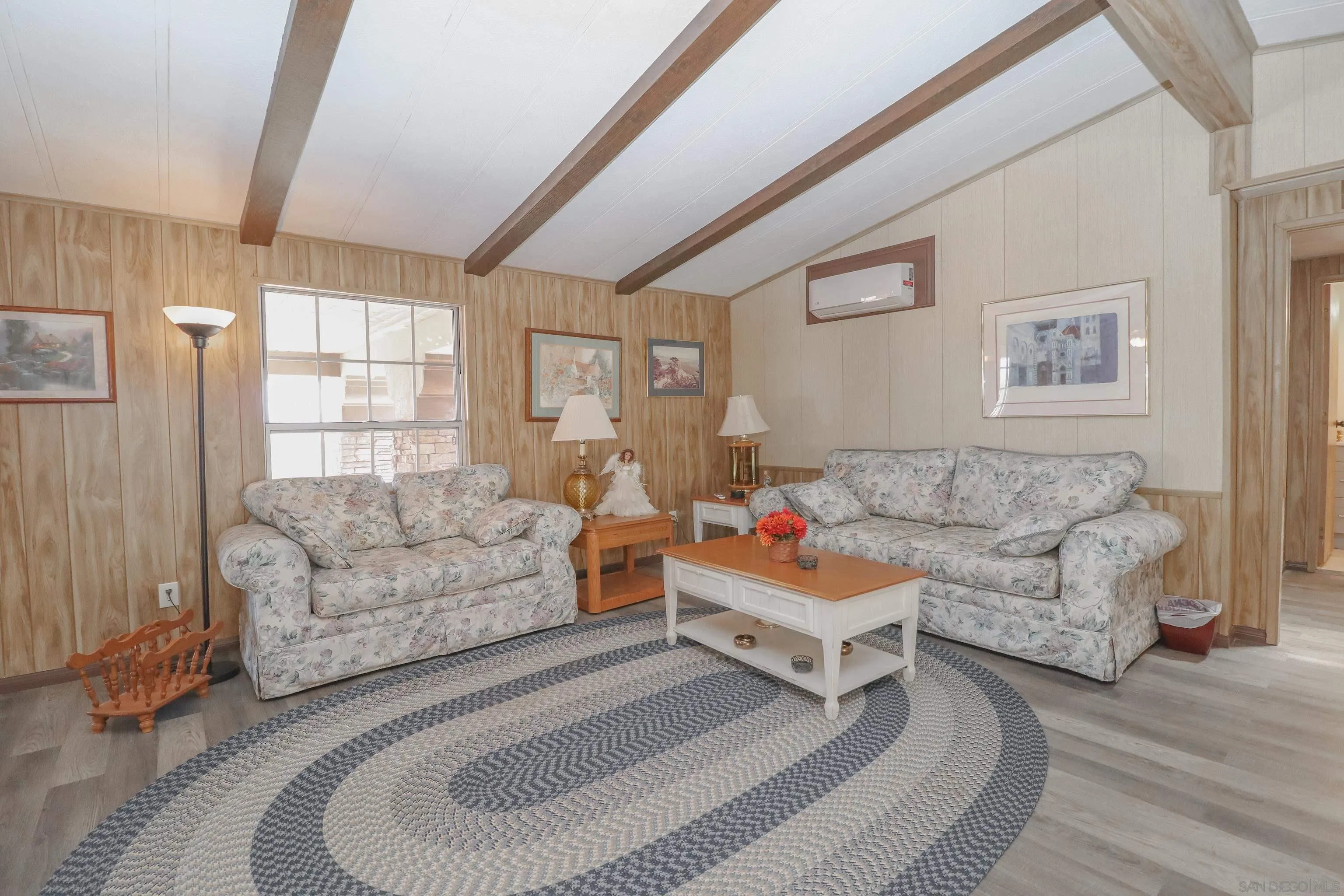 21141 Sharp Road Perris, CA 92570 - Photo 20 of 43 a living room with furniture and a large window