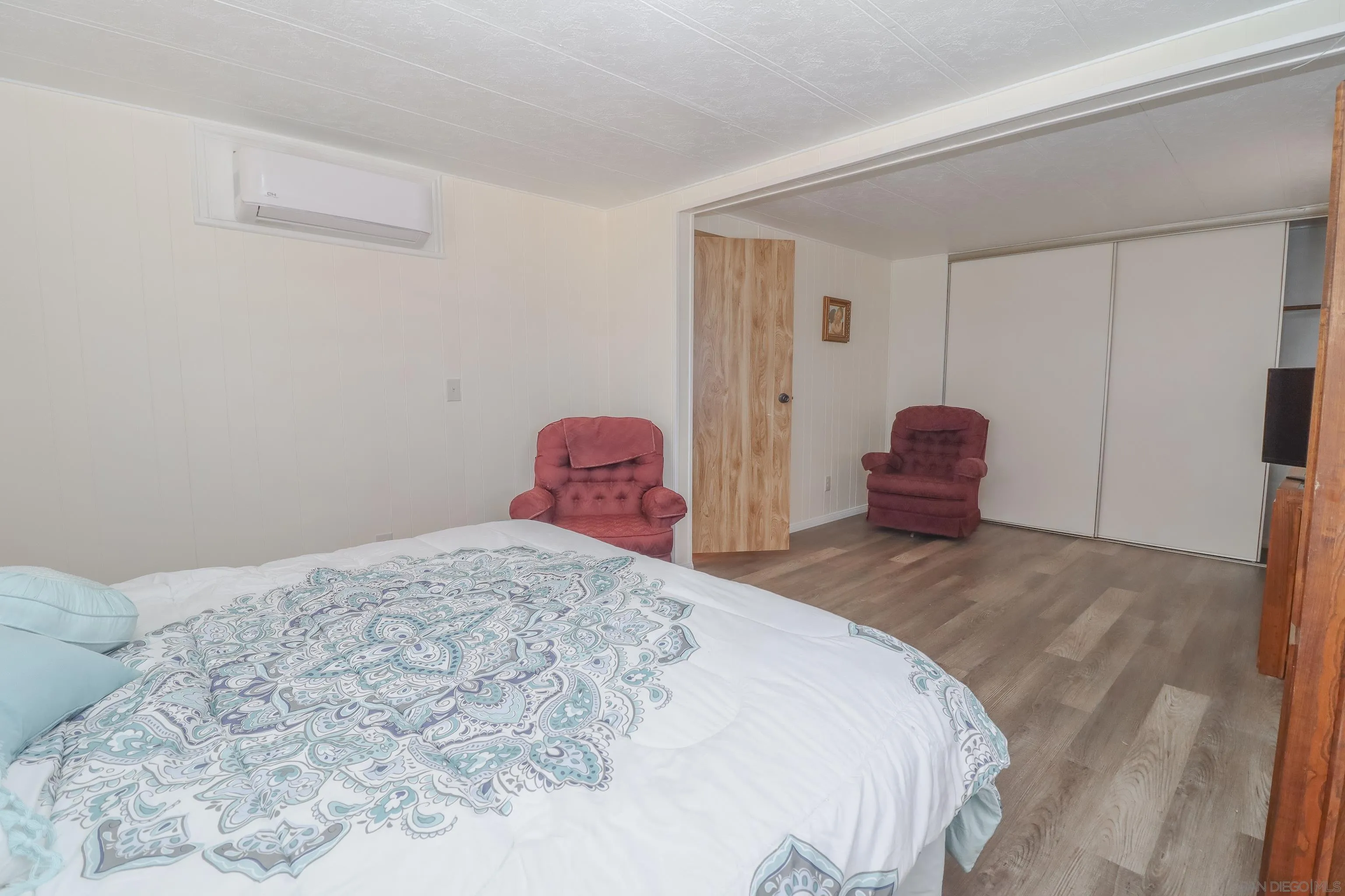 21141 Sharp Road Perris, CA 92570 - Photo 24 of 43 a bedroom with a bed and a window