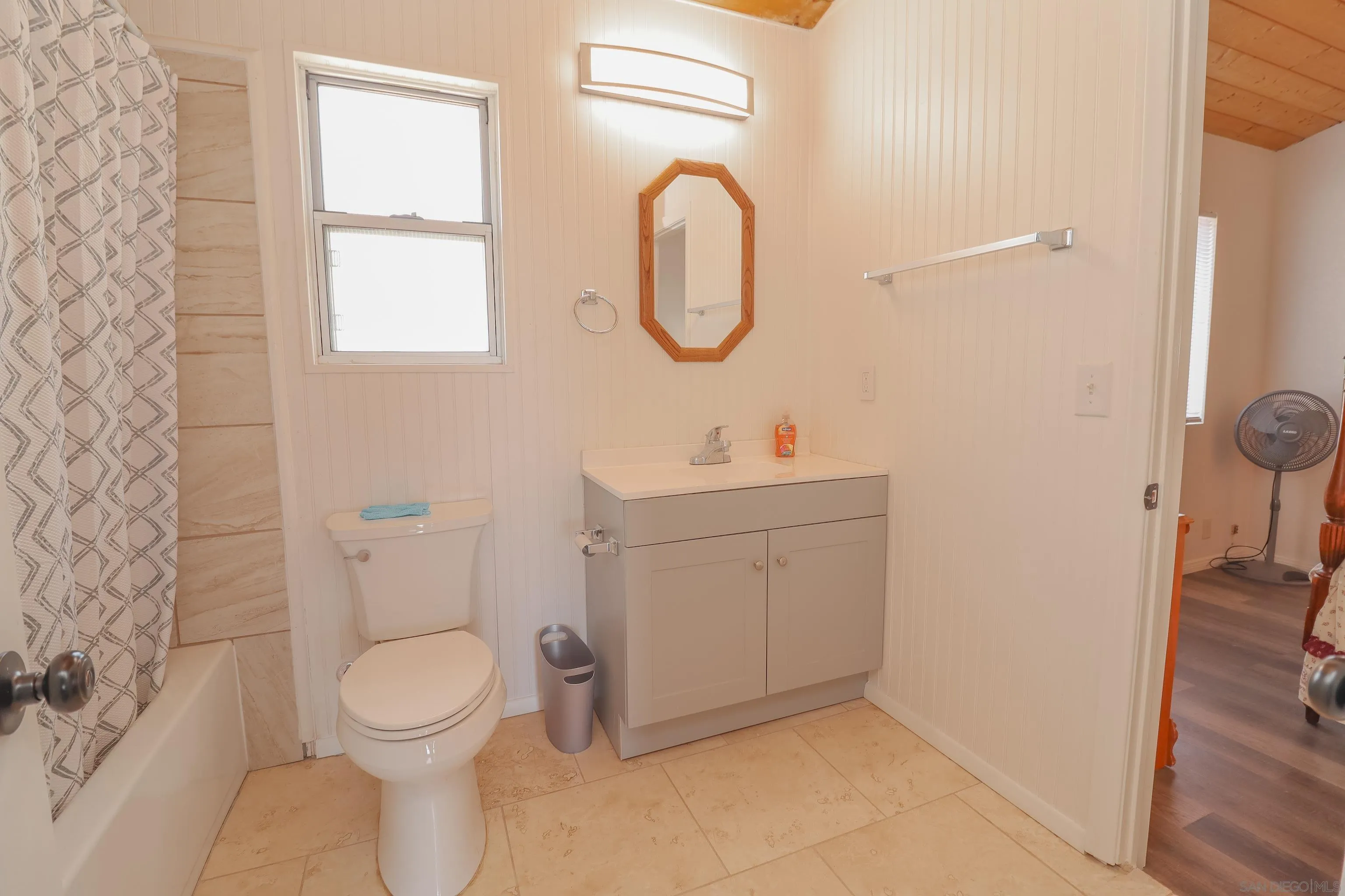 21141 Sharp Road Perris, CA 92570 - Photo 25 of 43 a bathroom with a toilet sink vanity and mirror