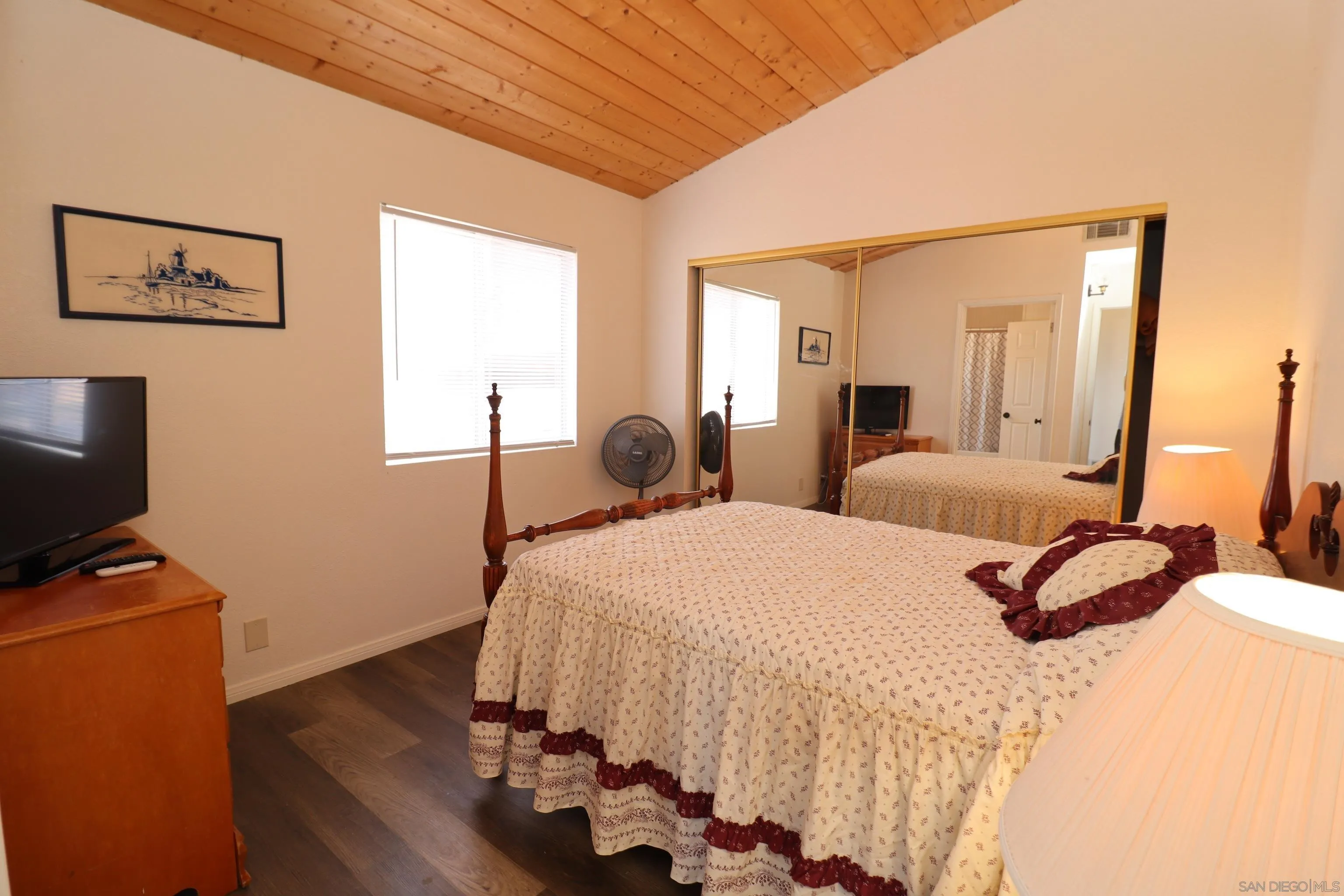 21141 Sharp Road Perris, CA 92570 - Photo 26 of 43 a bedroom with a bed and wooden floor