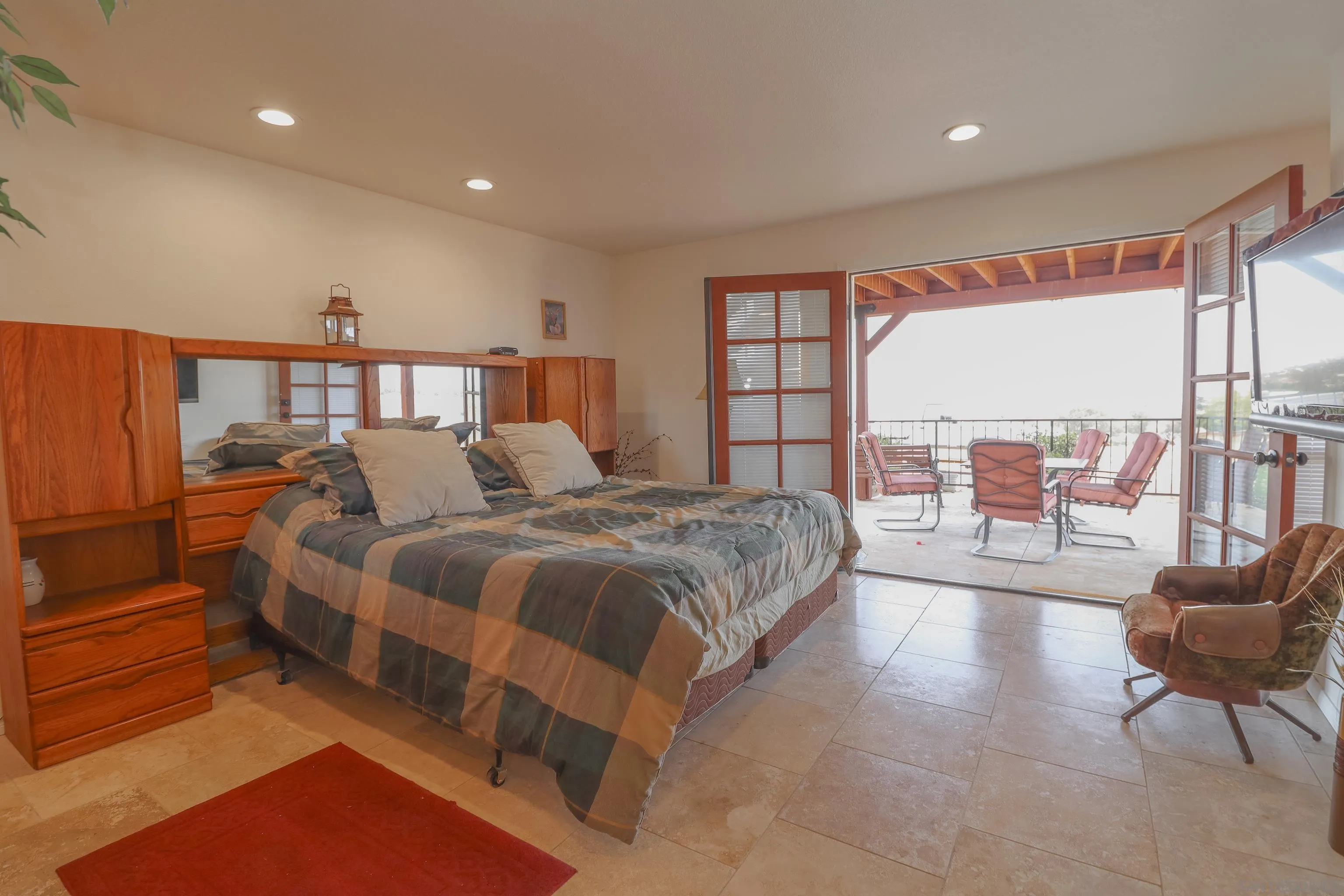 21141 Sharp Road Perris, CA 92570 - Photo 27 of 43 a spacious bedroom with a large bed and a large window