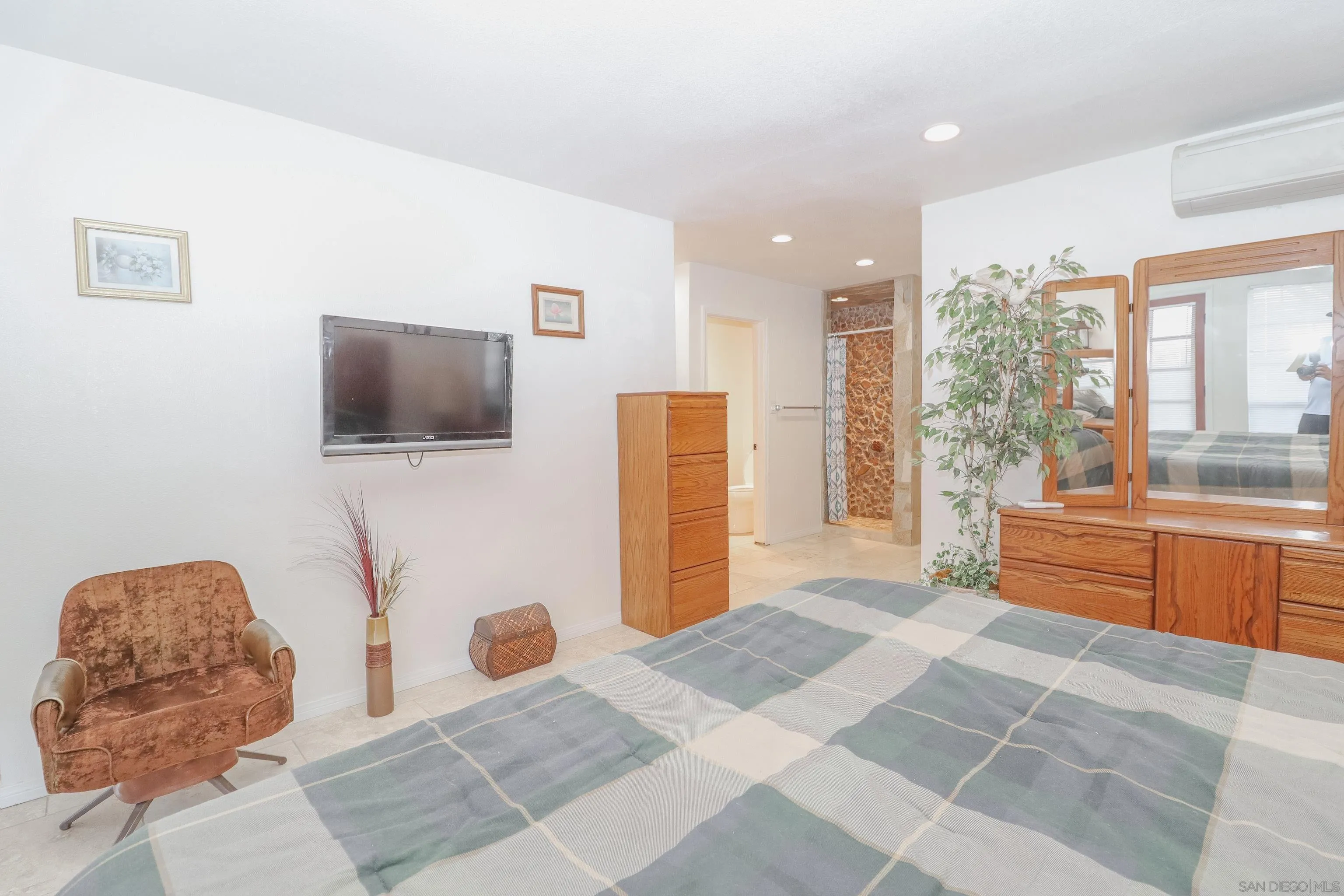 21141 Sharp Road Perris, CA 92570 - Photo 28 of 43 a bedroom with a bed and wooden floor