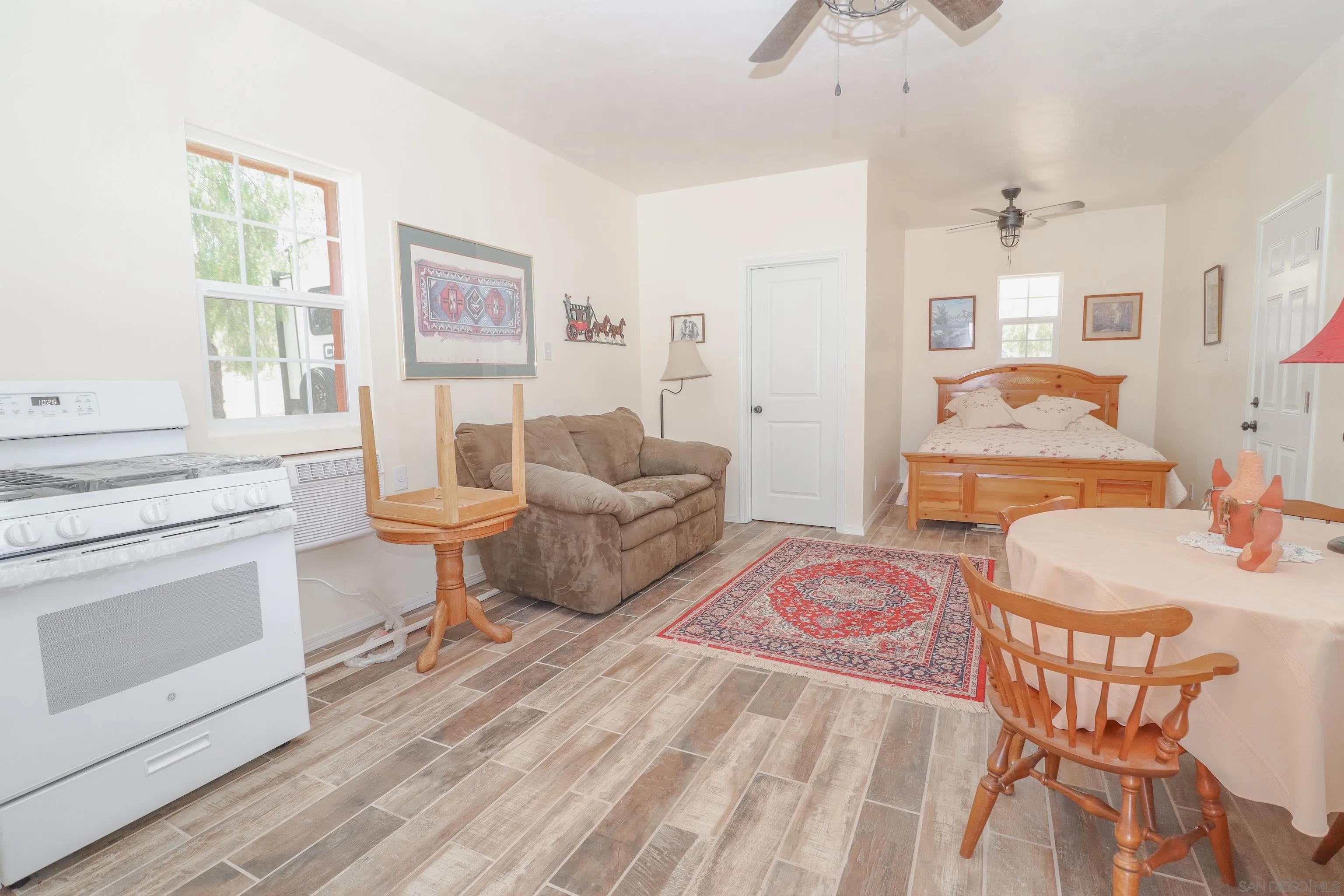21141 Sharp Road Perris, CA 92570 - Photo 30 of 43 a living room with furniture and a fireplace