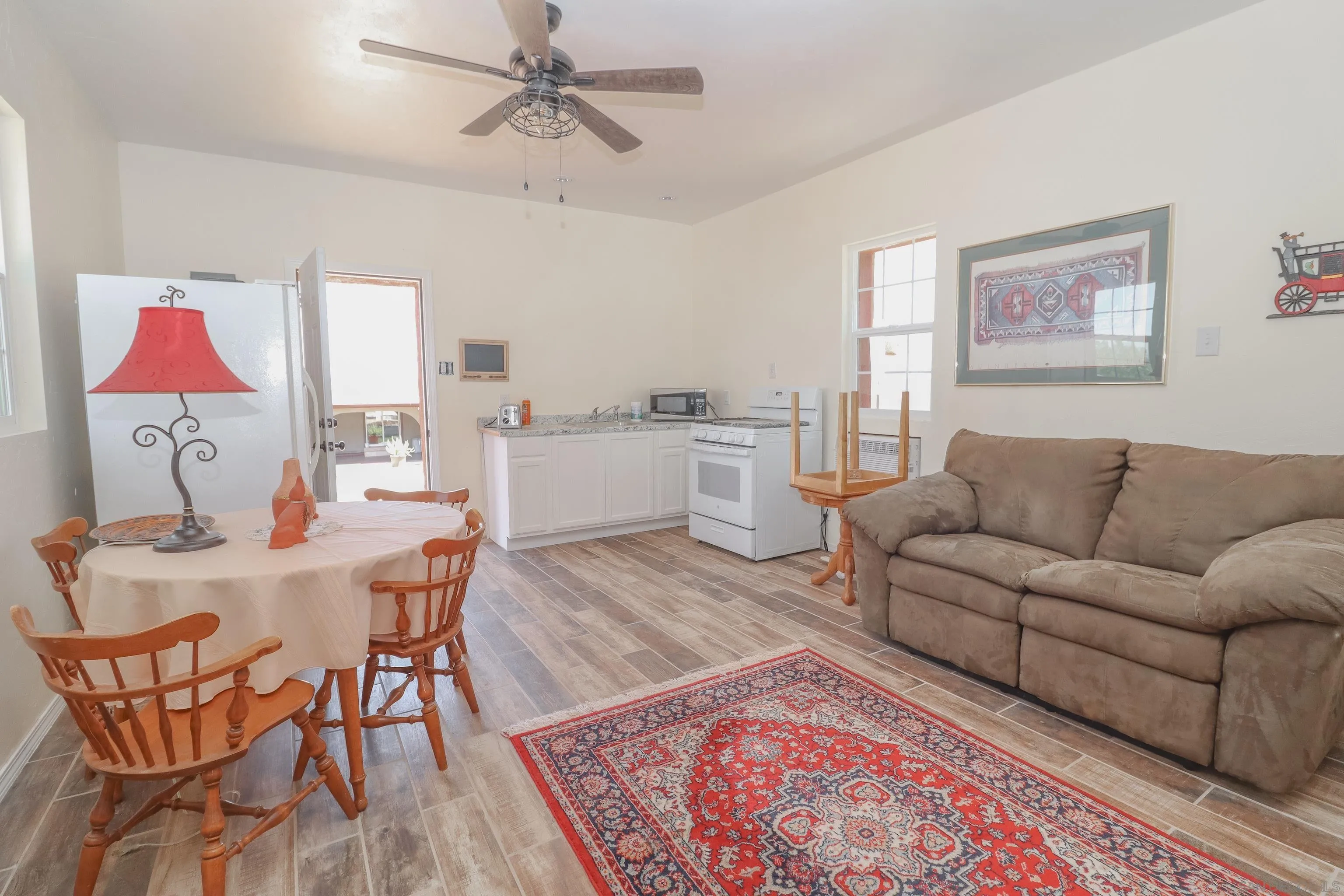21141 Sharp Road Perris, CA 92570 - Photo 31 of 43 a living room with furniture and a wooden floor