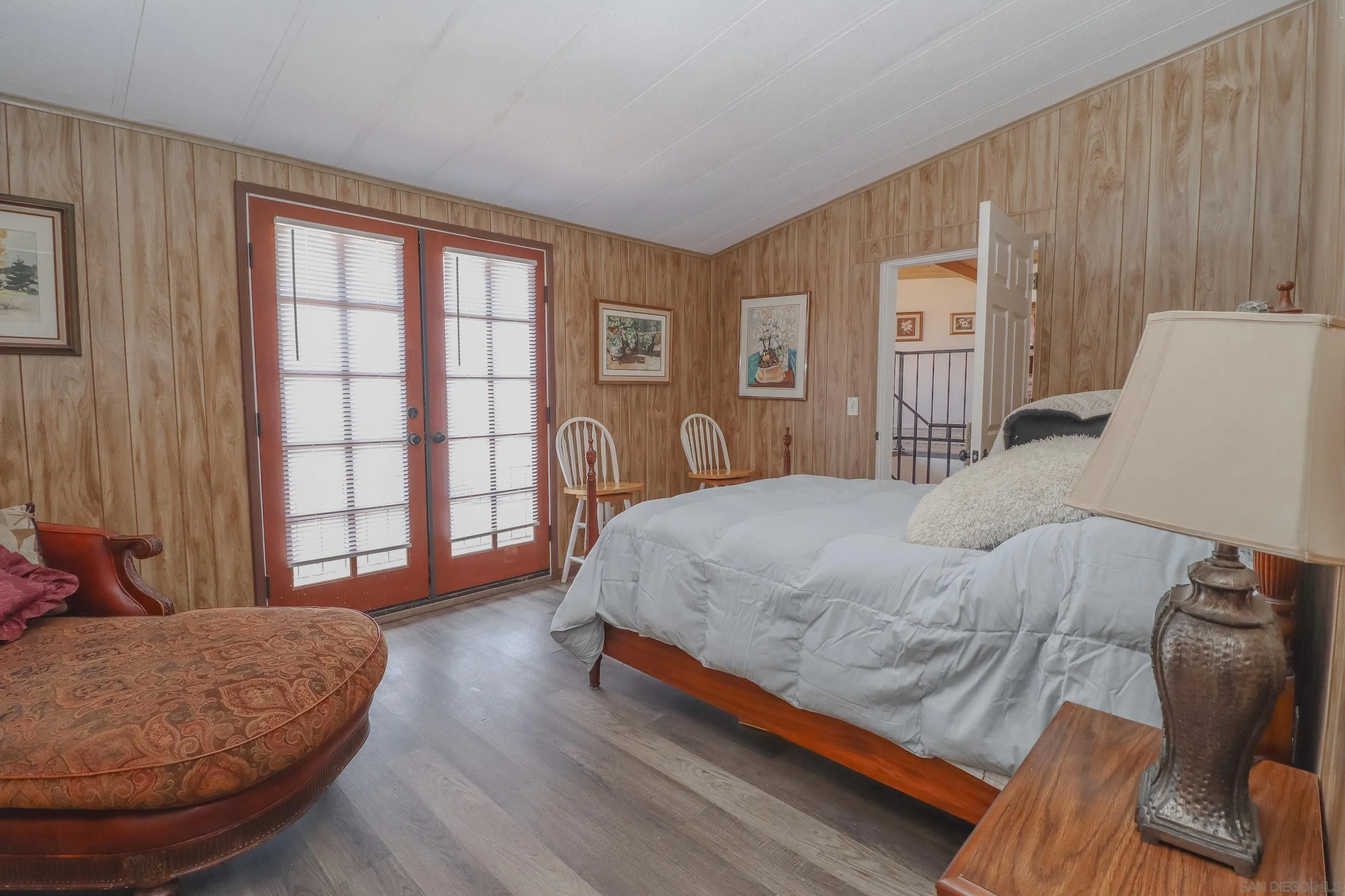 21141 Sharp Road Perris, CA 92570 - Photo 32 of 43 a bedroom with a bed and wooden floor