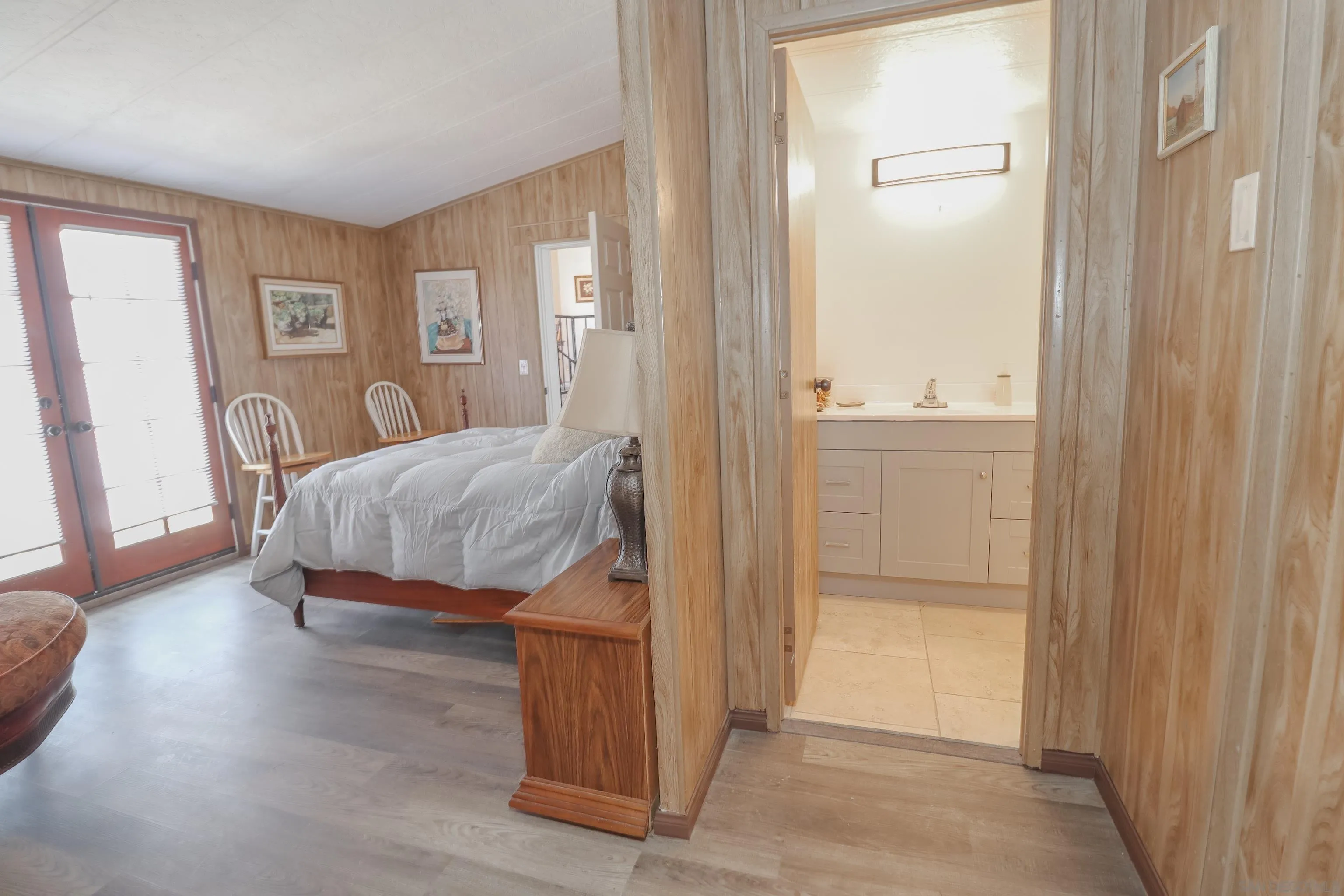 21141 Sharp Road Perris, CA 92570 - Photo 33 of 43 a bedroom with a bed and a mirror