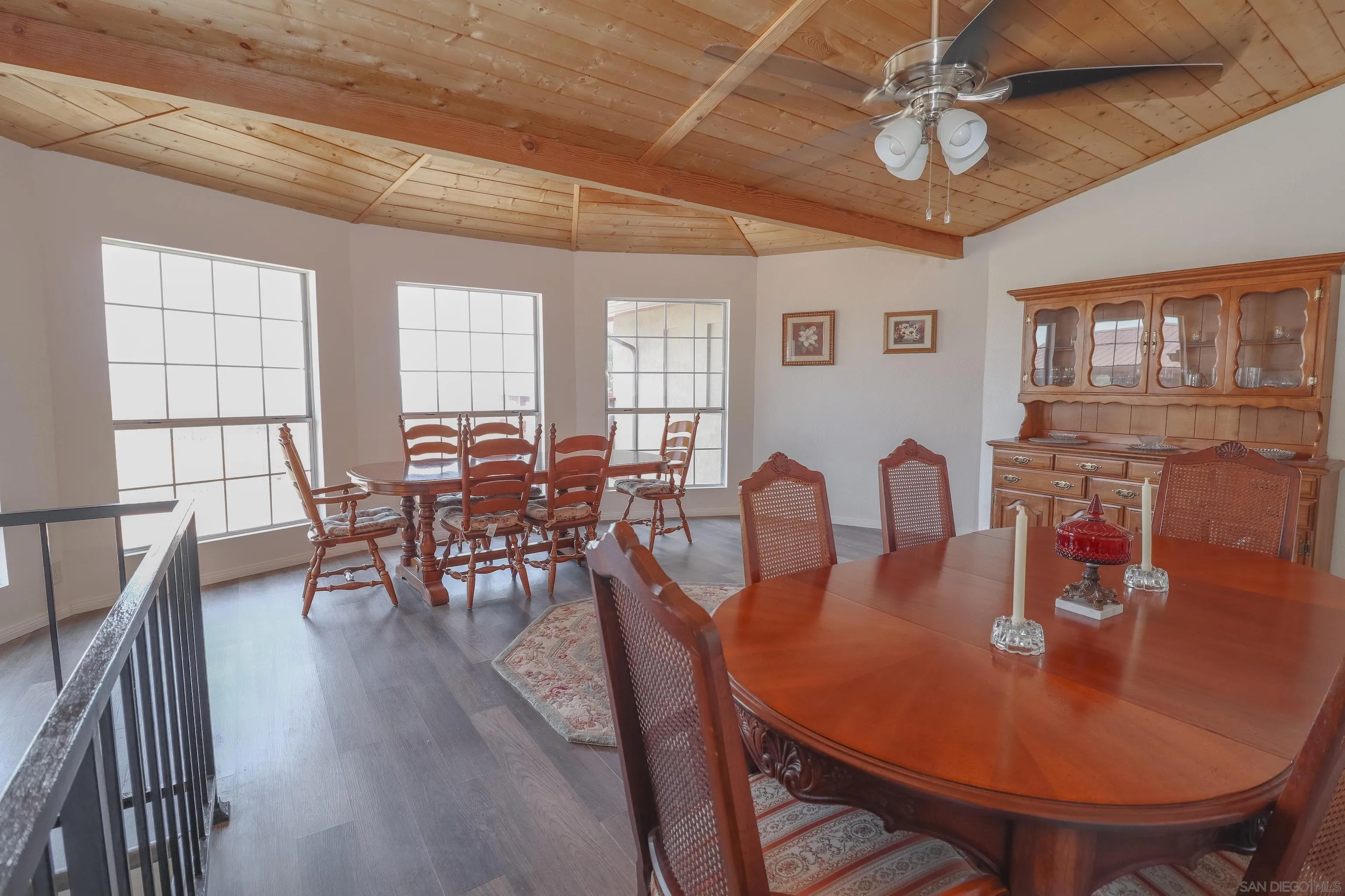 21141 Sharp Road Perris, CA 92570 - Photo 34 of 43 a dining room with furniture a chandelier and wooden floor