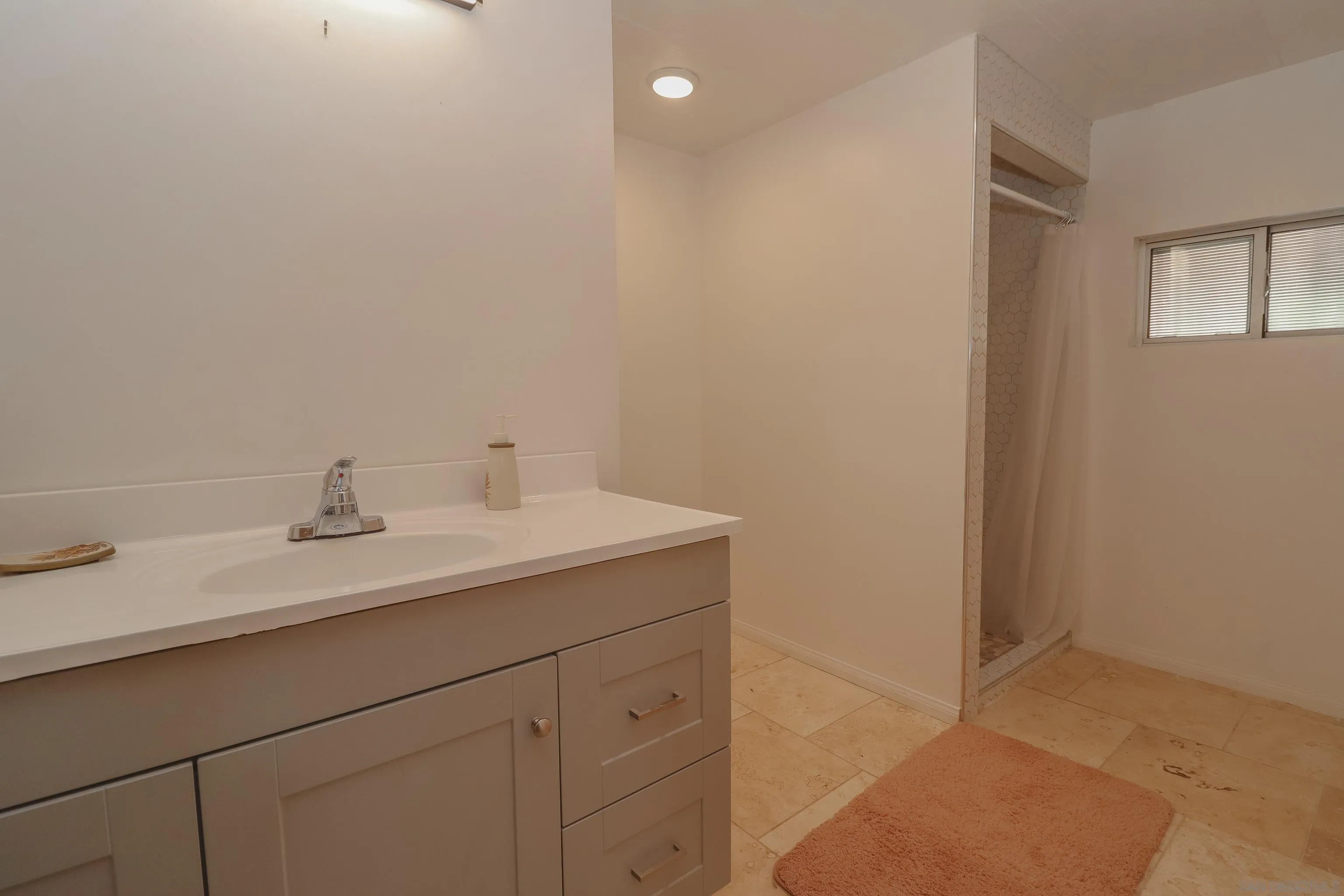 21141 Sharp Road Perris, CA 92570 - Photo 36 of 43 a bathroom with a sink and a mirror