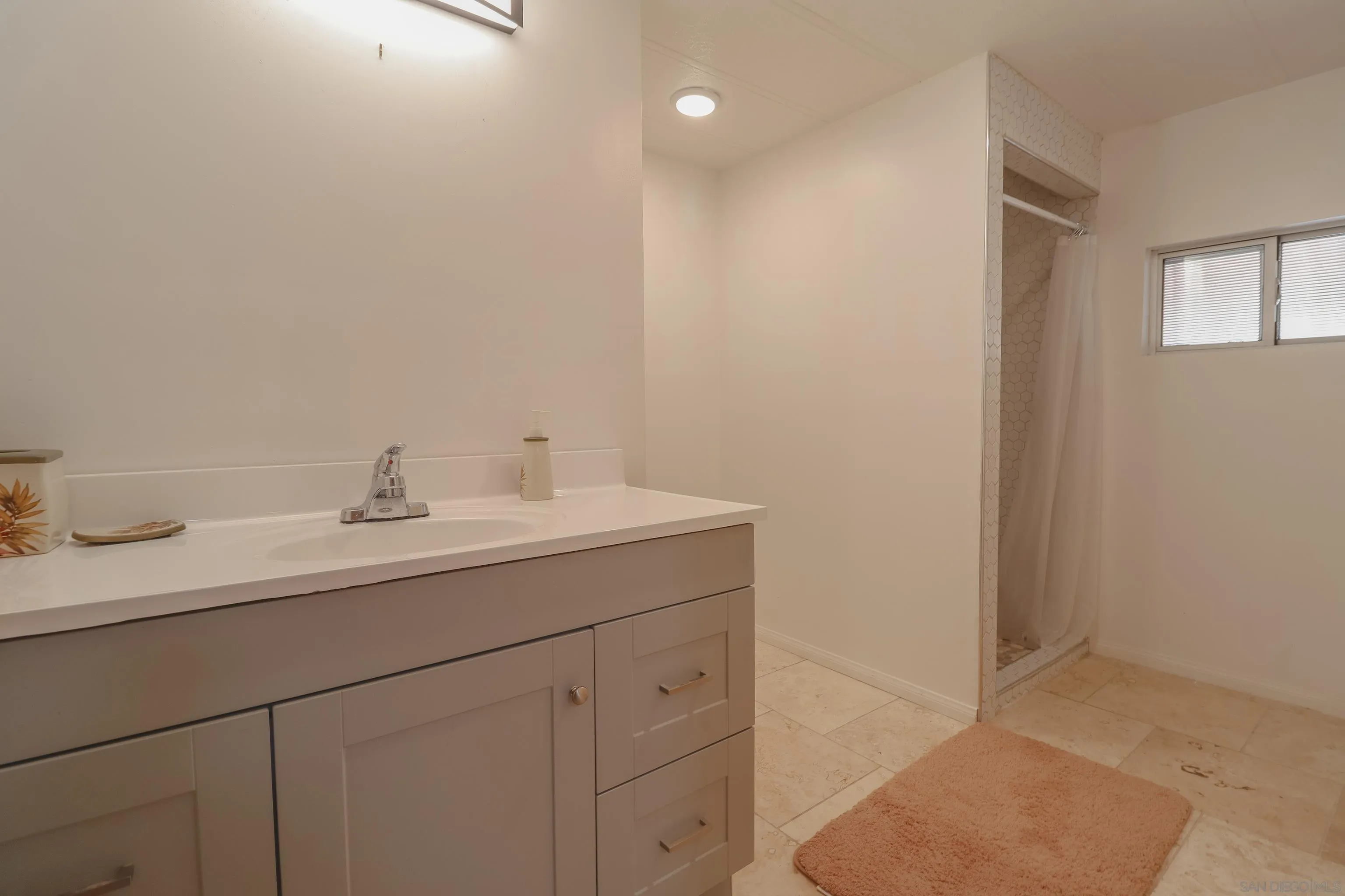 21141 Sharp Road Perris, CA 92570 - Photo 38 of 43 a bathroom with a sink and a mirror