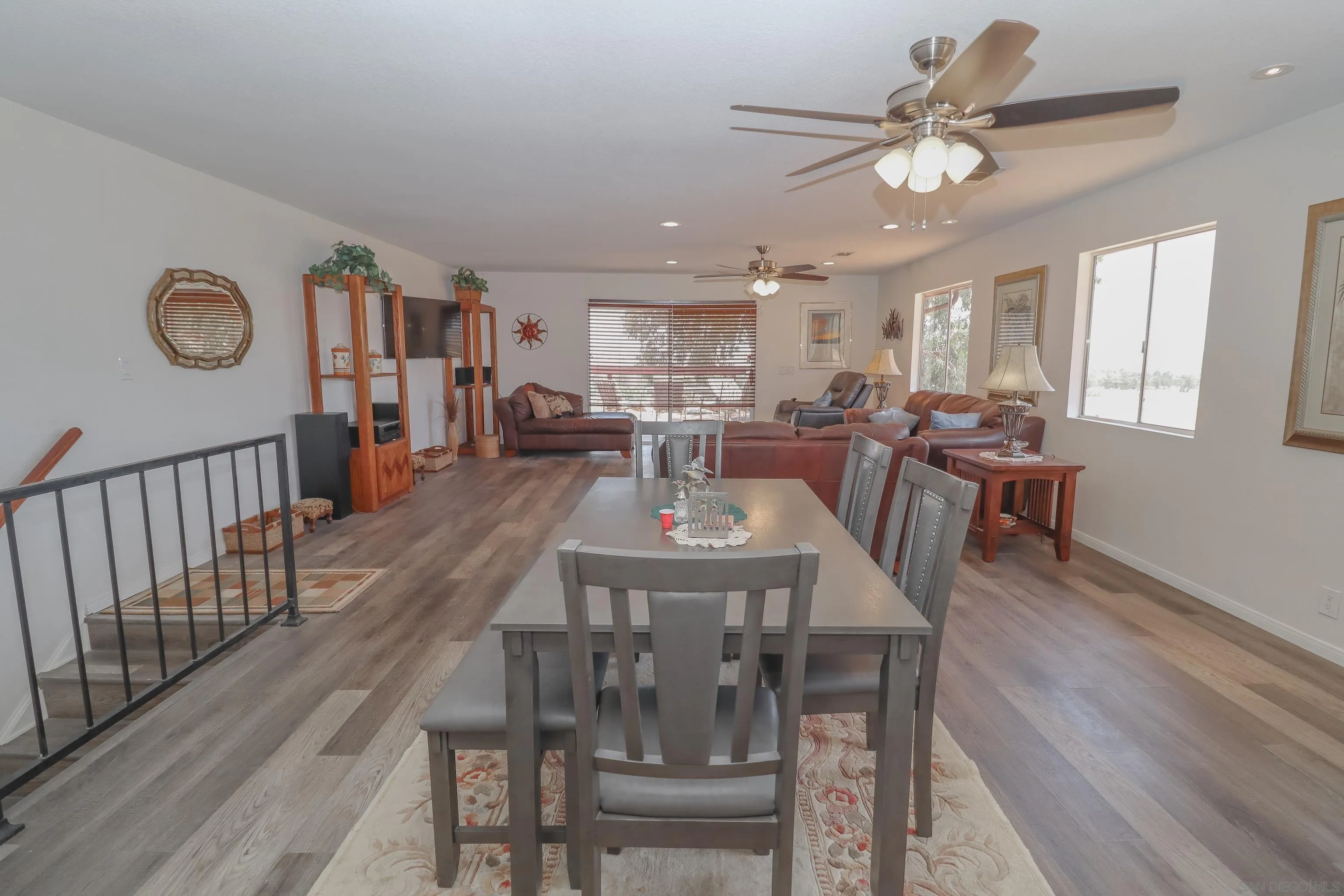 21141 Sharp Road Perris, CA 92570 - Photo 8 of 43 a view of a dining room with furniture window and wooden floor