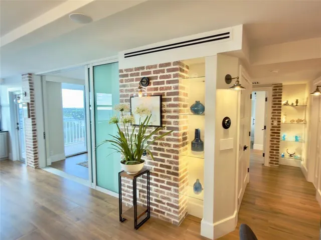 a bathroom with a glass shower door and a glass door