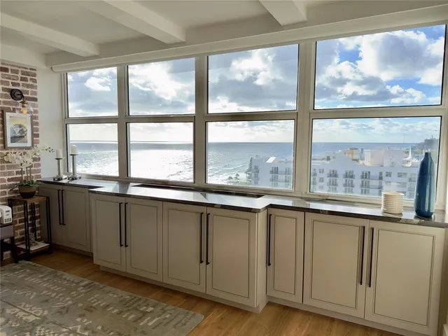 a view of a large window with kitchen area