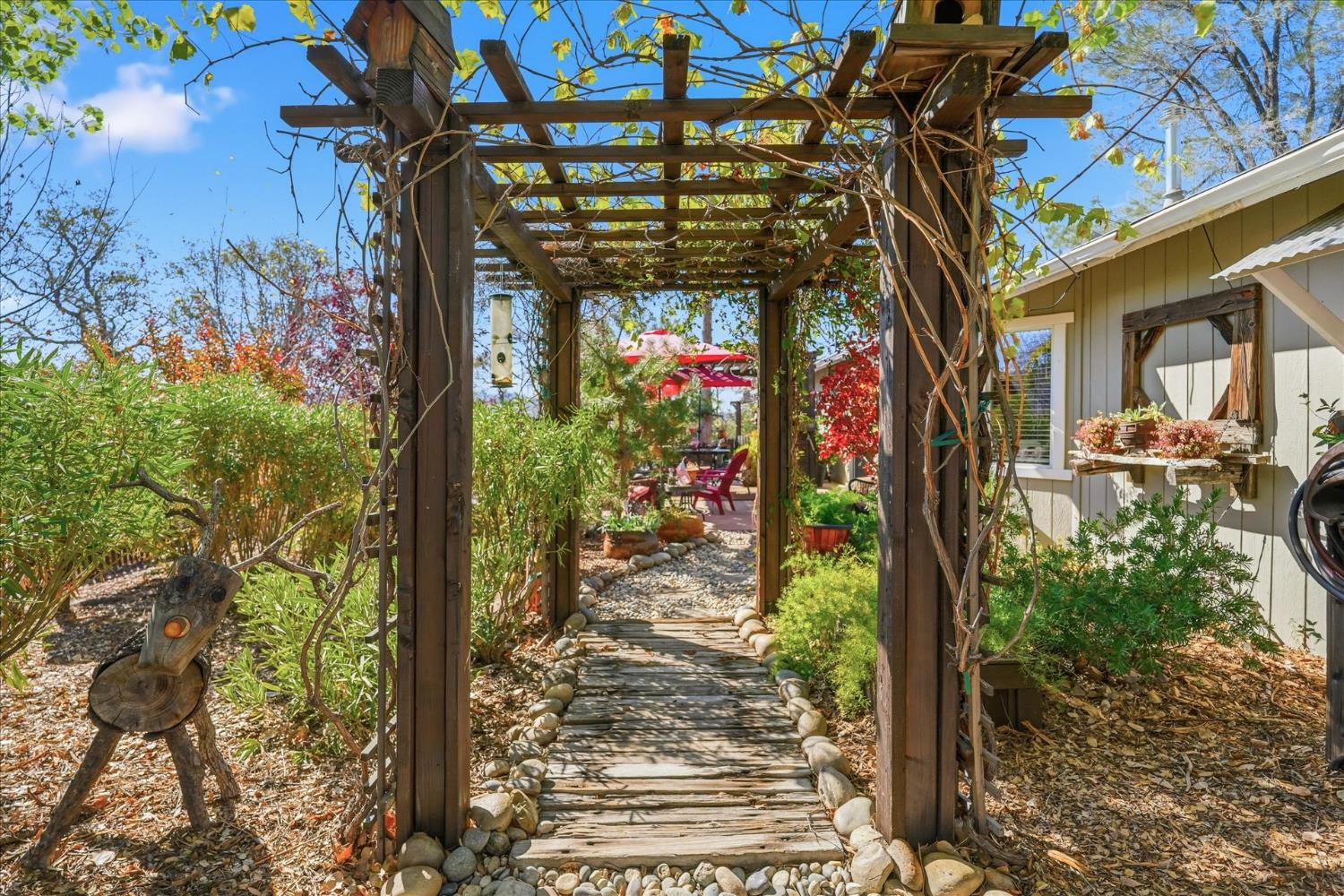 32583 River Knolls Road Coarsegold, CA 93614 - Photo 51 of 63 a view of a pathway of a building