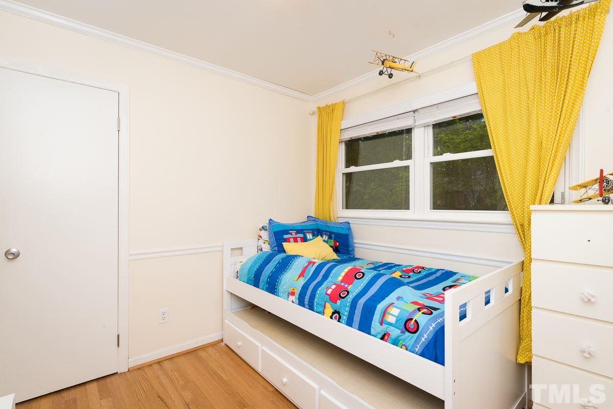 1602 Fountain Ridge Road Chapel Hill, NC 27517 - Photo 22 of 29 a bedroom with a bed and a window