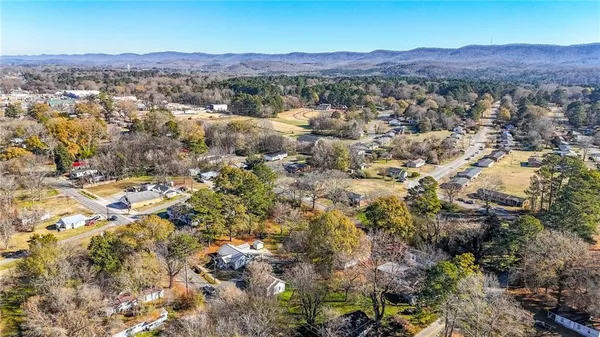 an aerial view of residential house and green space