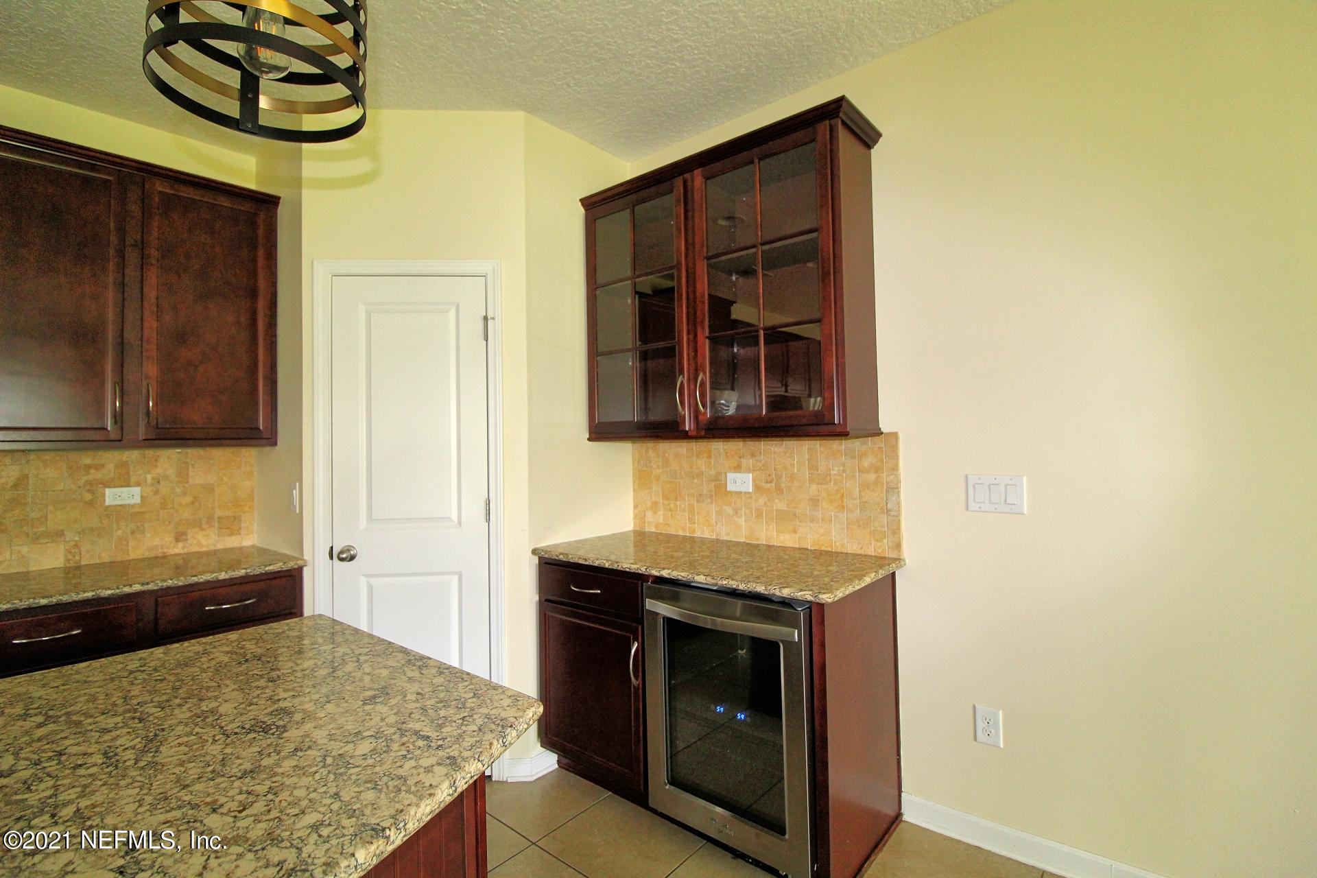 3207 Chestnut Ridge Way, Unit 18F Orange Park, FL 32065 - Photo 7 of 28 Wine hutch and fridge