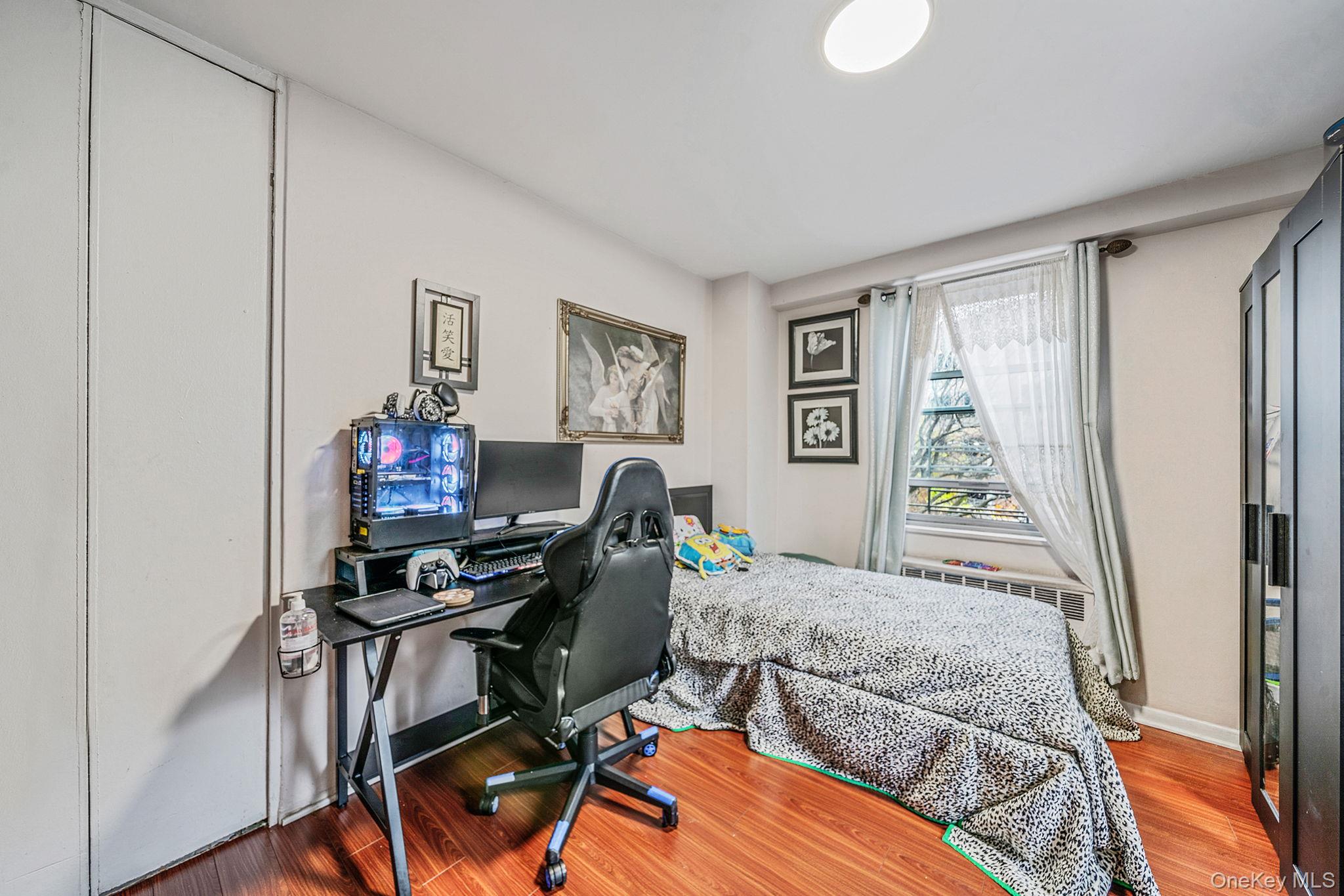 61-25 97th Street, Unit 2B Queens, NY 11374 - Photo 16 of 22 a workspace with furniture and a window