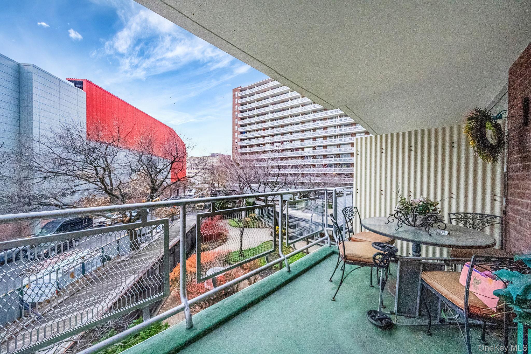 61-25 97th Street, Unit 2B Queens, NY 11374 - Photo 6 of 22 a reading room with furniture and umbrella