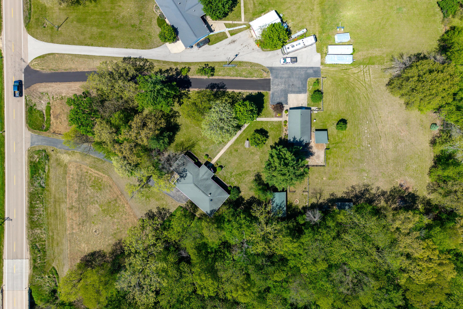 2660 252nd Street De Witt, IA 52742 - Photo 40 of 45 an aerial view of a house with a yard