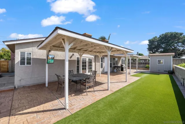 a view of a house with a yard patio and a patio