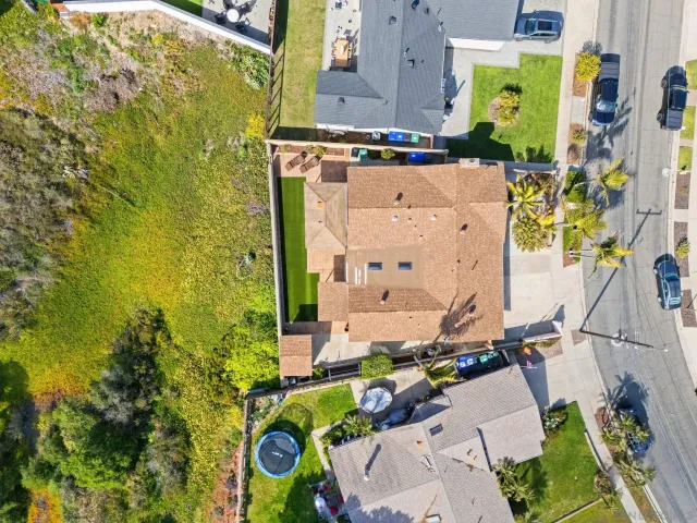 an aerial view of residential house with outdoor space and parking