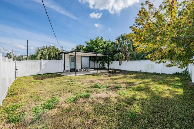 an aerial view of a house with a garden