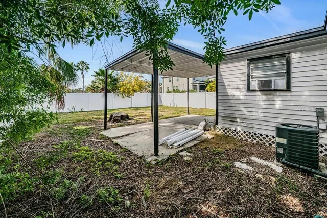 an aerial view of residential houses with outdoor space and street view