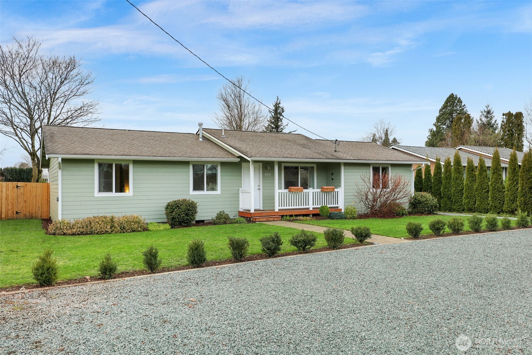 402 Haines Street Sedro-Woolley, WA 98284 - Photo 1 of 24 a front view of a house with a yard and garage