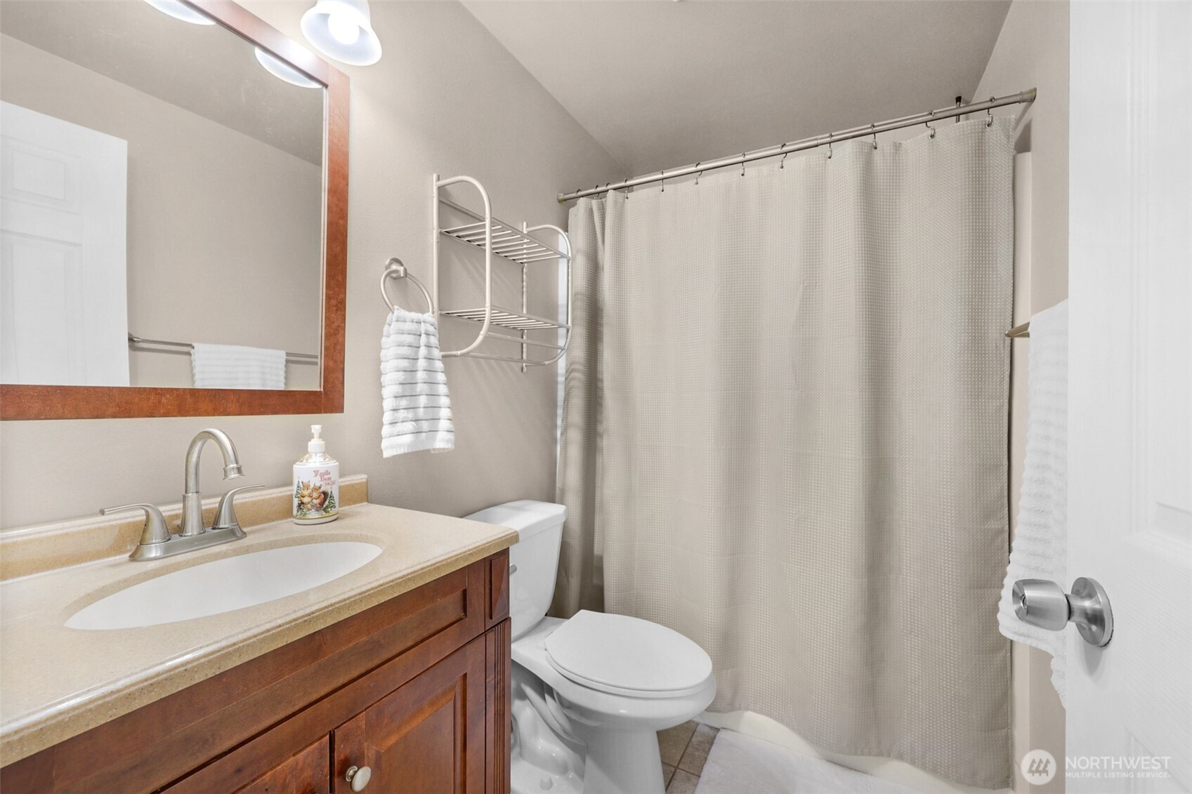 402 Haines Street Sedro-Woolley, WA 98284 - Photo 15 of 24 a bathroom with a granite countertop sink and a mirror