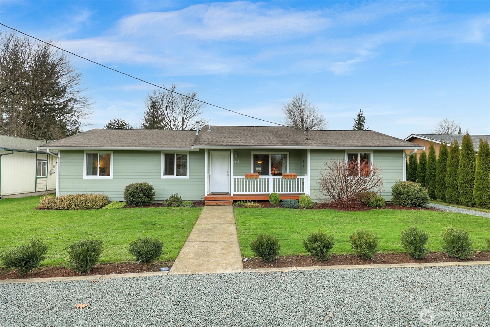 402 Haines Street Sedro-Woolley, WA 98284 - Photo 3 of 24 a front view of a house with garden