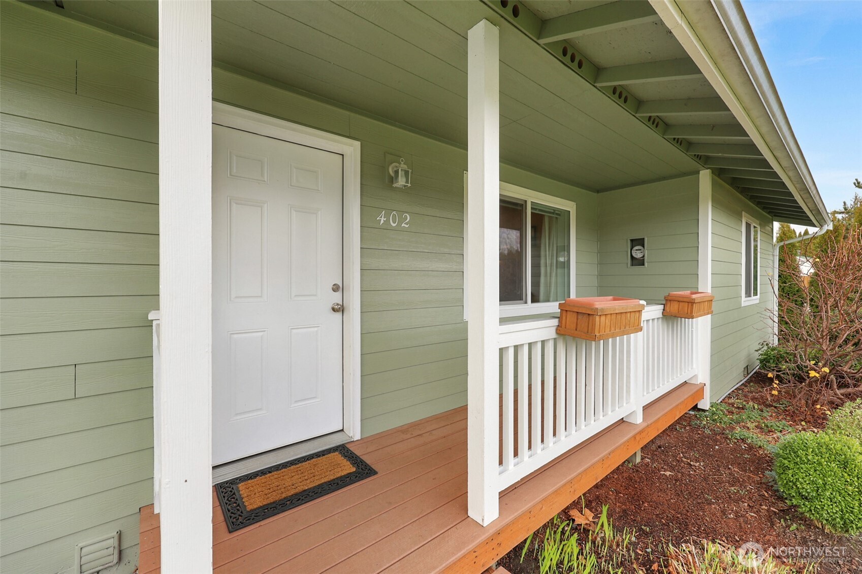 402 Haines Street Sedro-Woolley, WA 98284 - Photo 4 of 24 a view of a porch with wooden floor and stairs