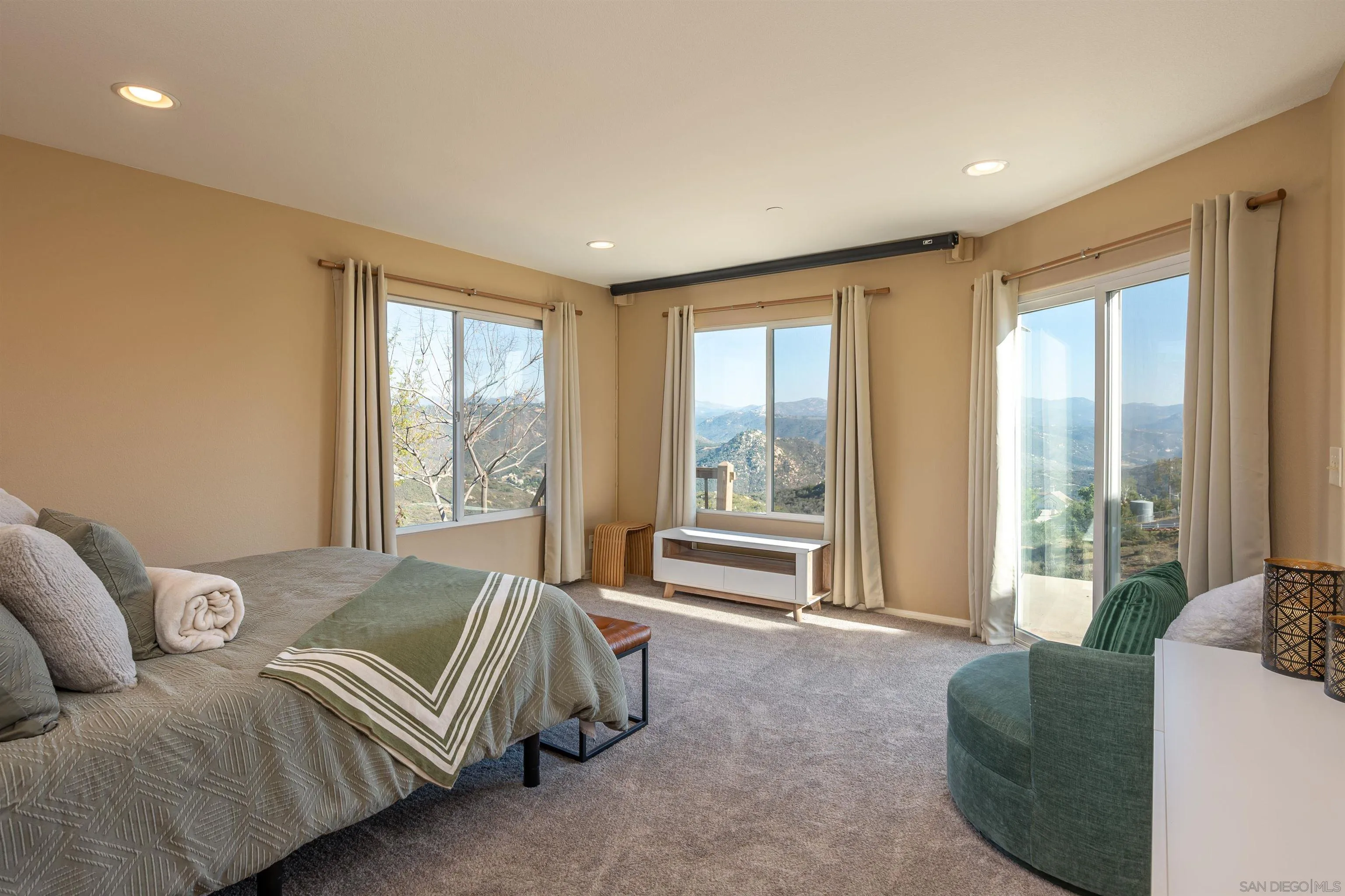 1152 Stoneridge Road El Cajon, CA 92021 - Photo 12 of 71 a spacious bedroom with a bed and glass window