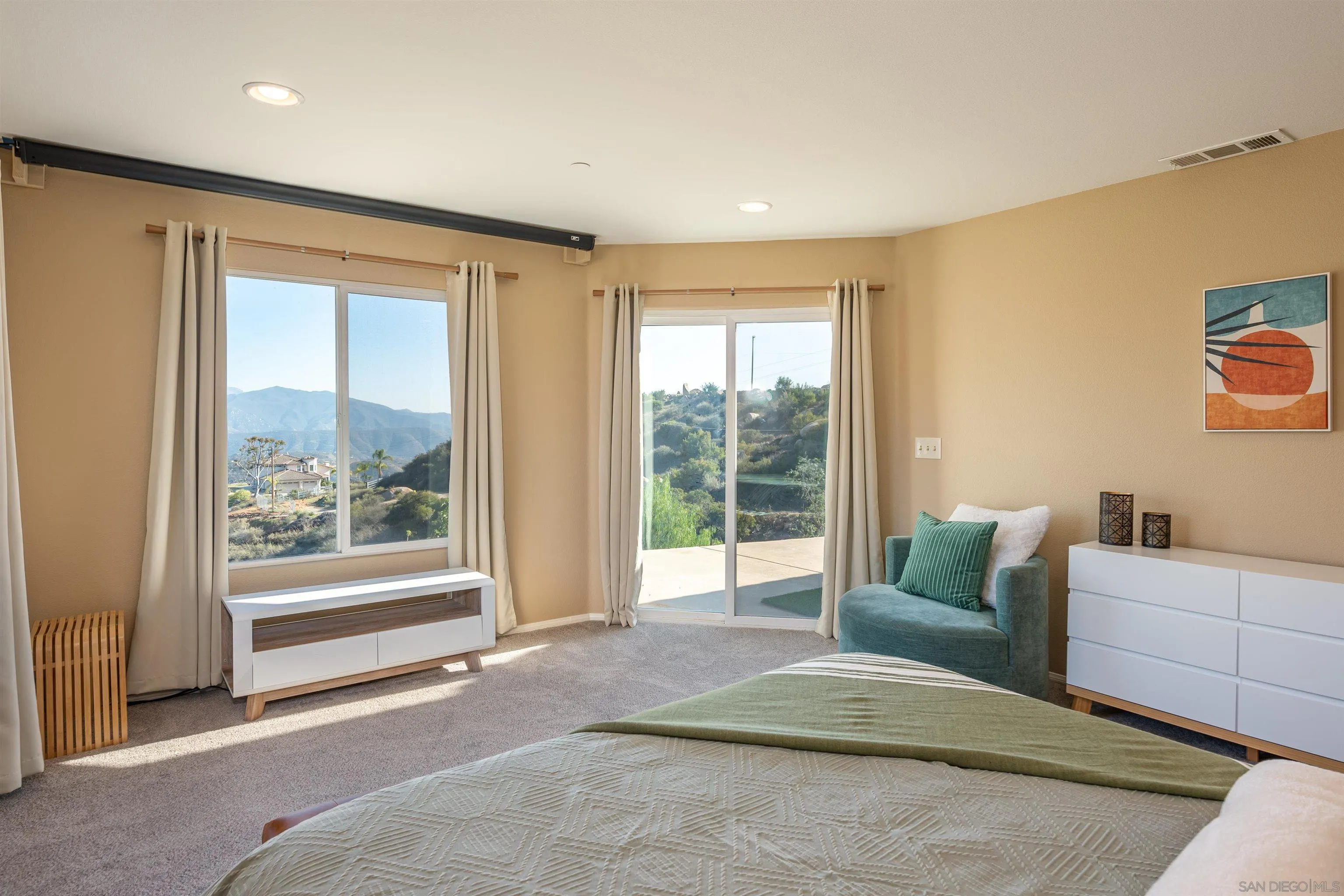 1152 Stoneridge Road El Cajon, CA 92021 - Photo 13 of 71 a spacious bedroom with a large bed and a large window