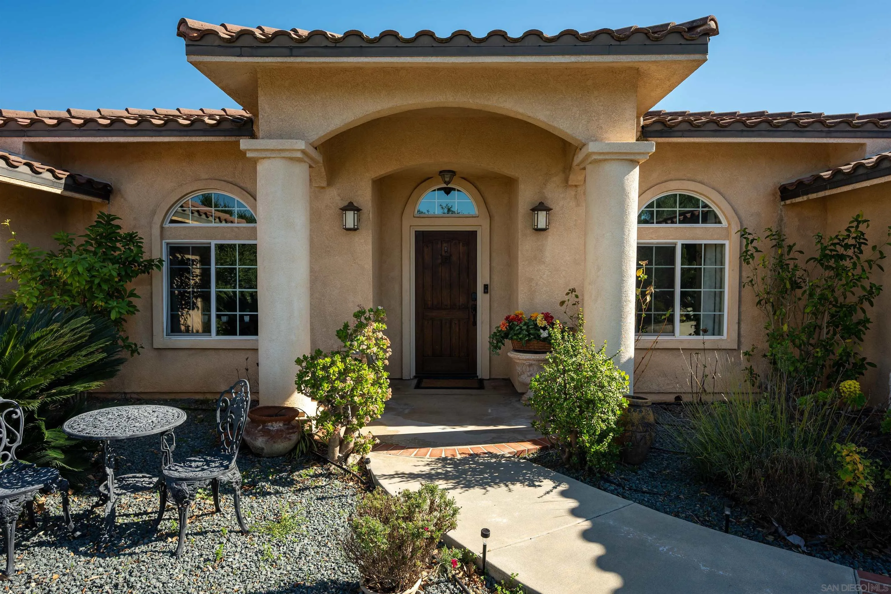 1152 Stoneridge Road El Cajon, CA 92021 - Photo 2 of 71 a front view of a house with a yard
