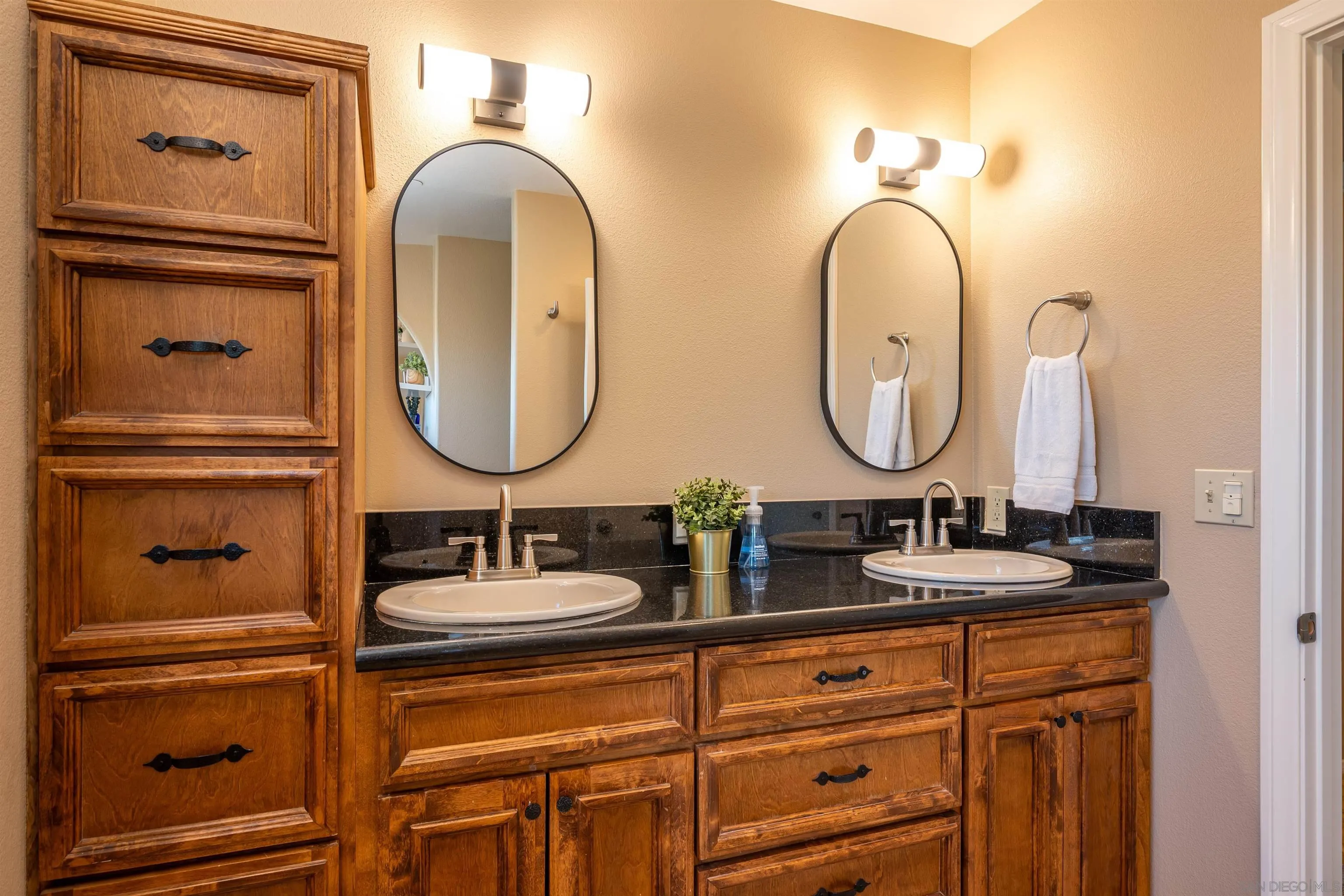 1152 Stoneridge Road El Cajon, CA 92021 - Photo 21 of 71 a bathroom with a double vanity sink and a mirror