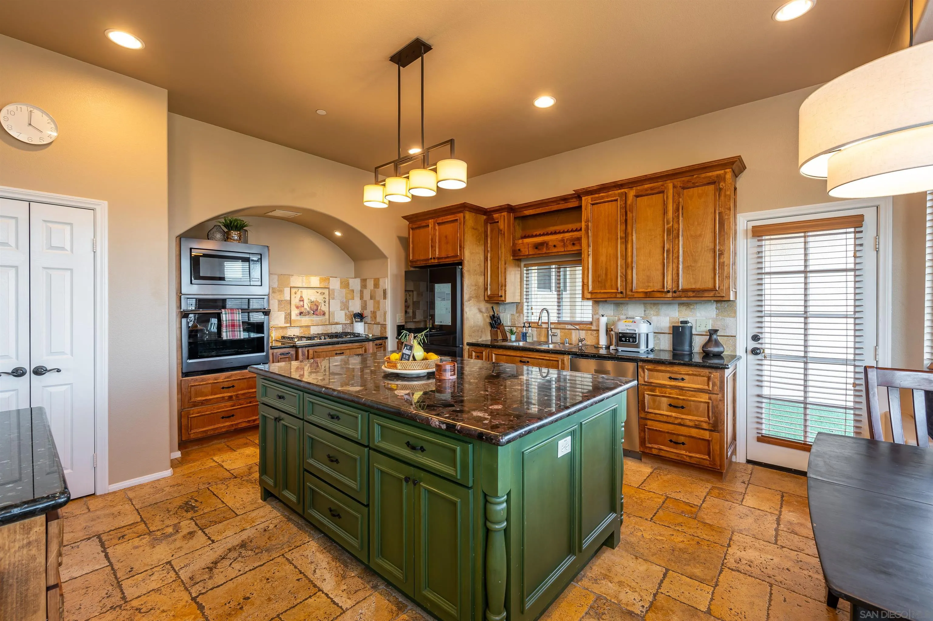 1152 Stoneridge Road El Cajon, CA 92021 - Photo 29 of 71 a kitchen with stainless steel appliances granite countertop a sink a stove and a wooden floors