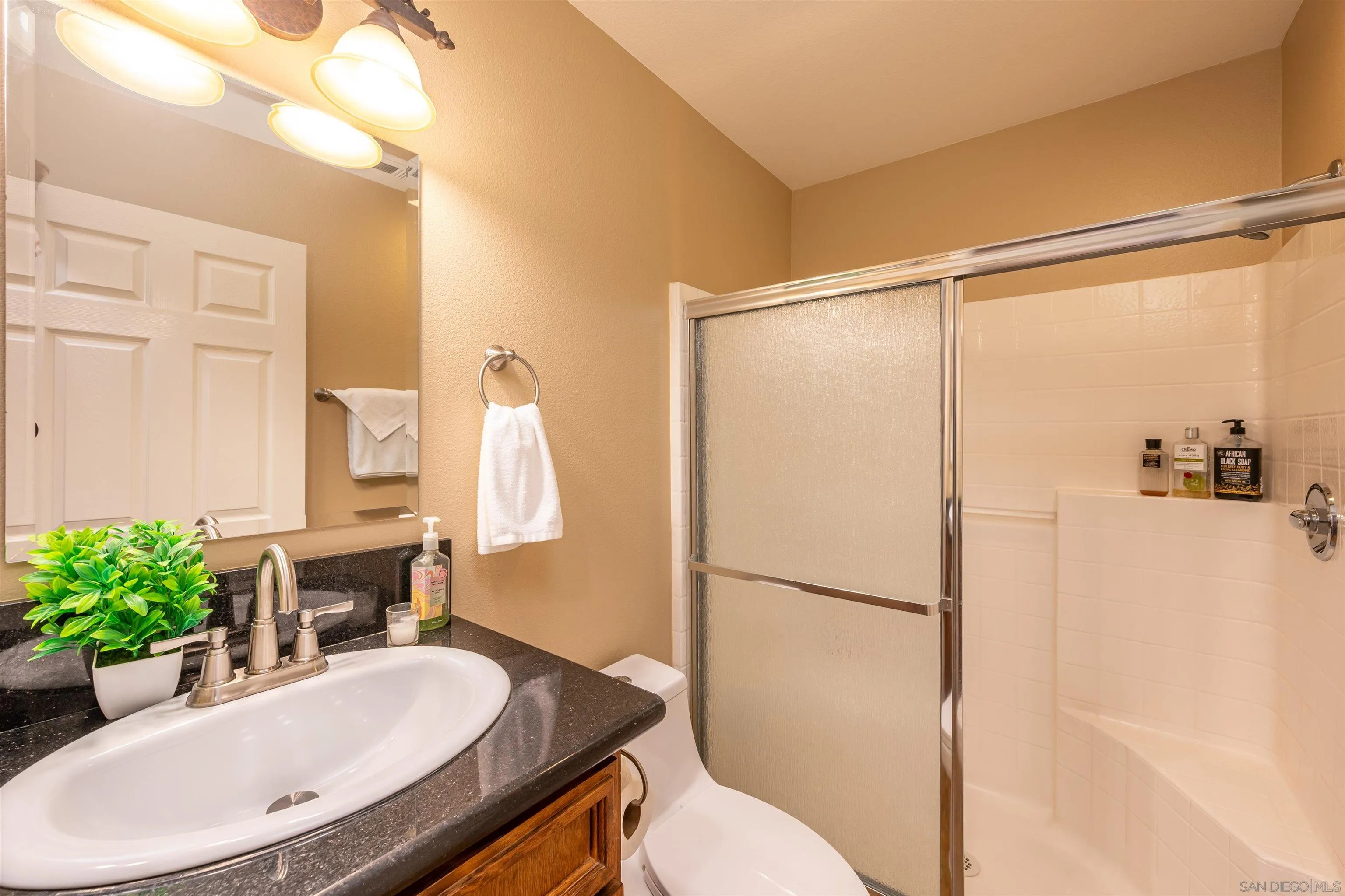 1152 Stoneridge Road El Cajon, CA 92021 - Photo 34 of 71 a bathroom with a sink toilet and shower