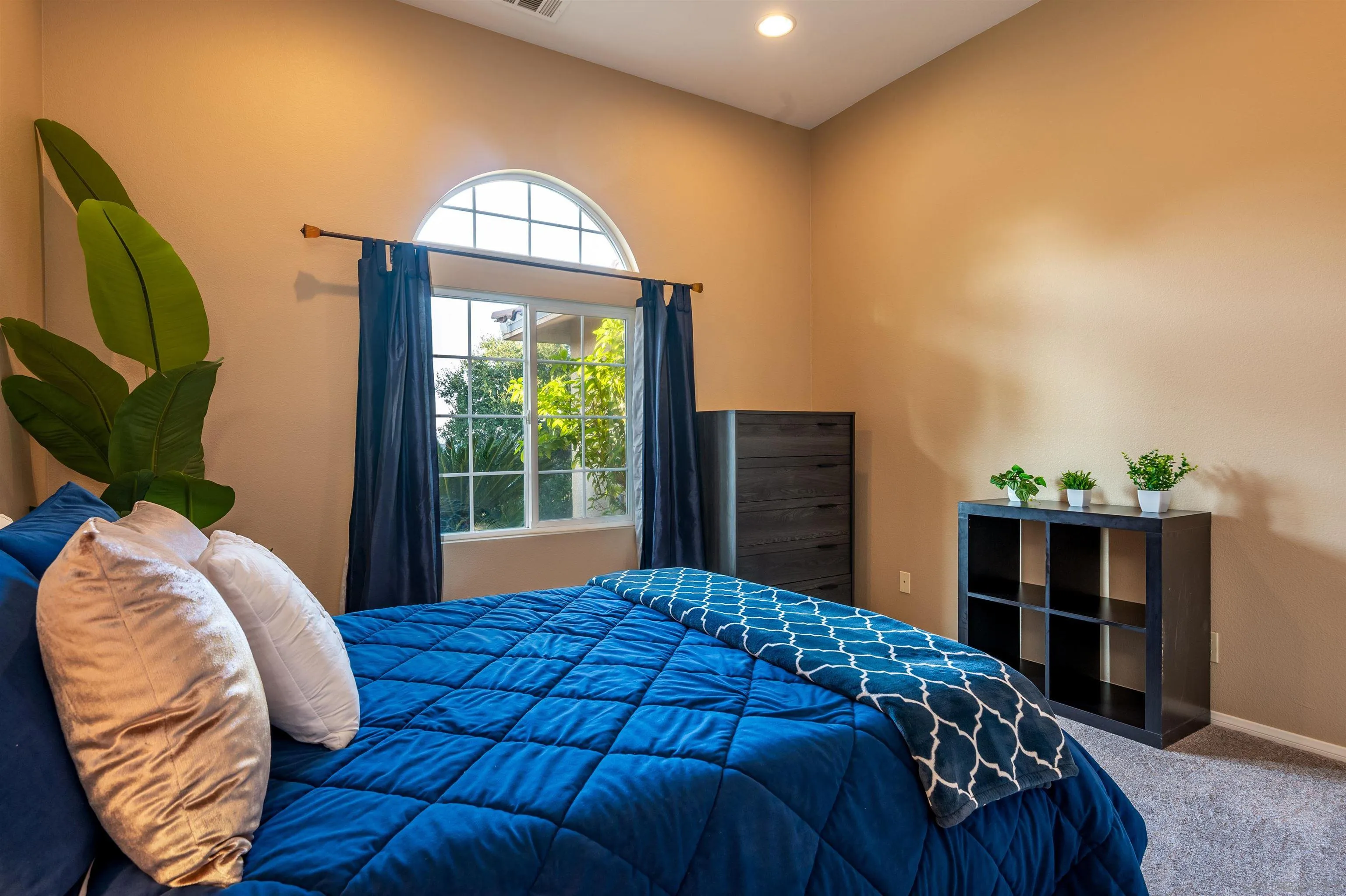 1152 Stoneridge Road El Cajon, CA 92021 - Photo 38 of 71 a bedroom with a bed dresser and a window